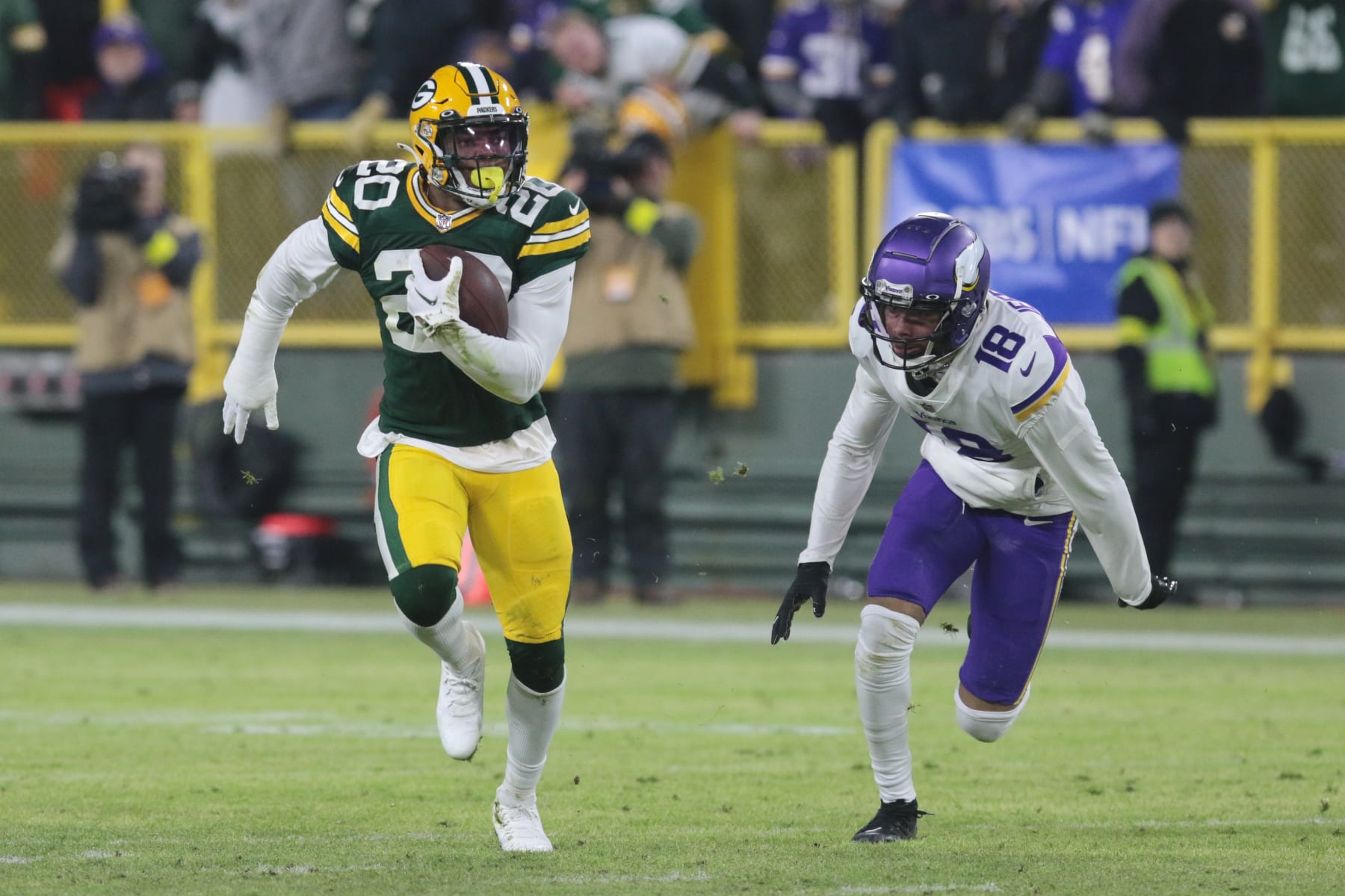 GREEN BAY, WI - JANUARY 01: Minnesota Vikings wide receiver Justin Jefferson (18) chases Green Bay Packers safety Rudy Ford (20) during a game between the Green Bay Packers and the Minnesota Vikings on January 1, 2023 at Lambeau Field in Green Bay, WI. (Photo by Larry Radloff/Icon Sportswire via Getty Images)