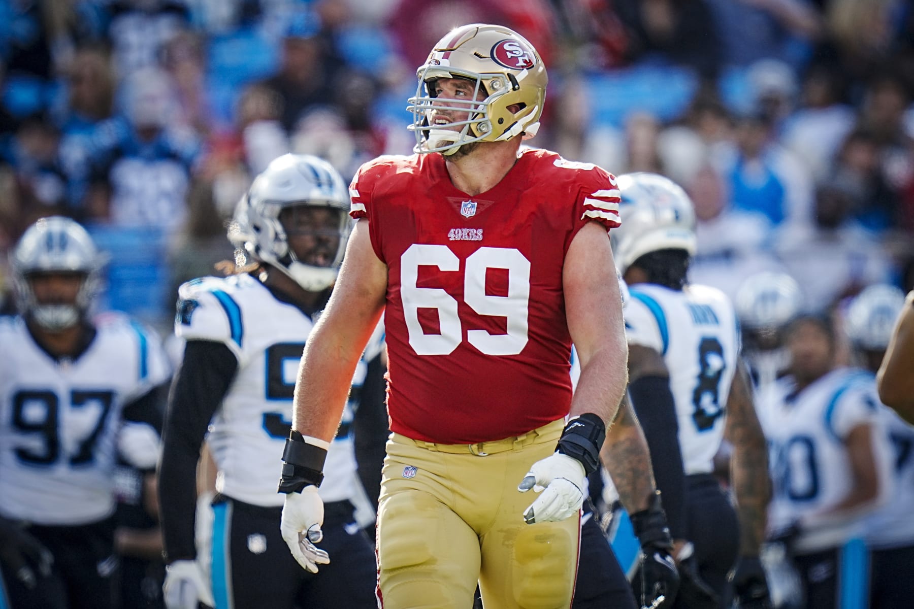 San Francisco 49ers offensive tackle Mike McGlinchey (69) looks at the video board during an NFL football game against the Carolina Panthers on Sunday, Oct. 09, 2022, in Charlotte, N.C. (AP Photo/Rusty Jones)