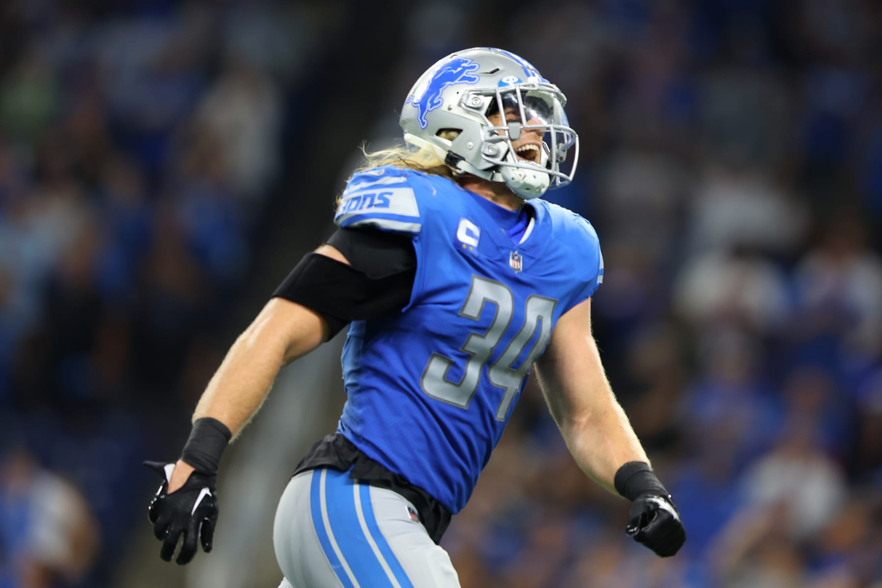 DETROIT, MICHIGAN - SEPTEMBER 18: Alex Anzalone #34 of the Detroit Lions reacts after Carson Wentz #11 of the Washington Commanders was sacked during the fourth quarter at Ford Field on September 18, 2022 in Detroit, Michigan. (Photo by Rey Del Rio/Getty Images)