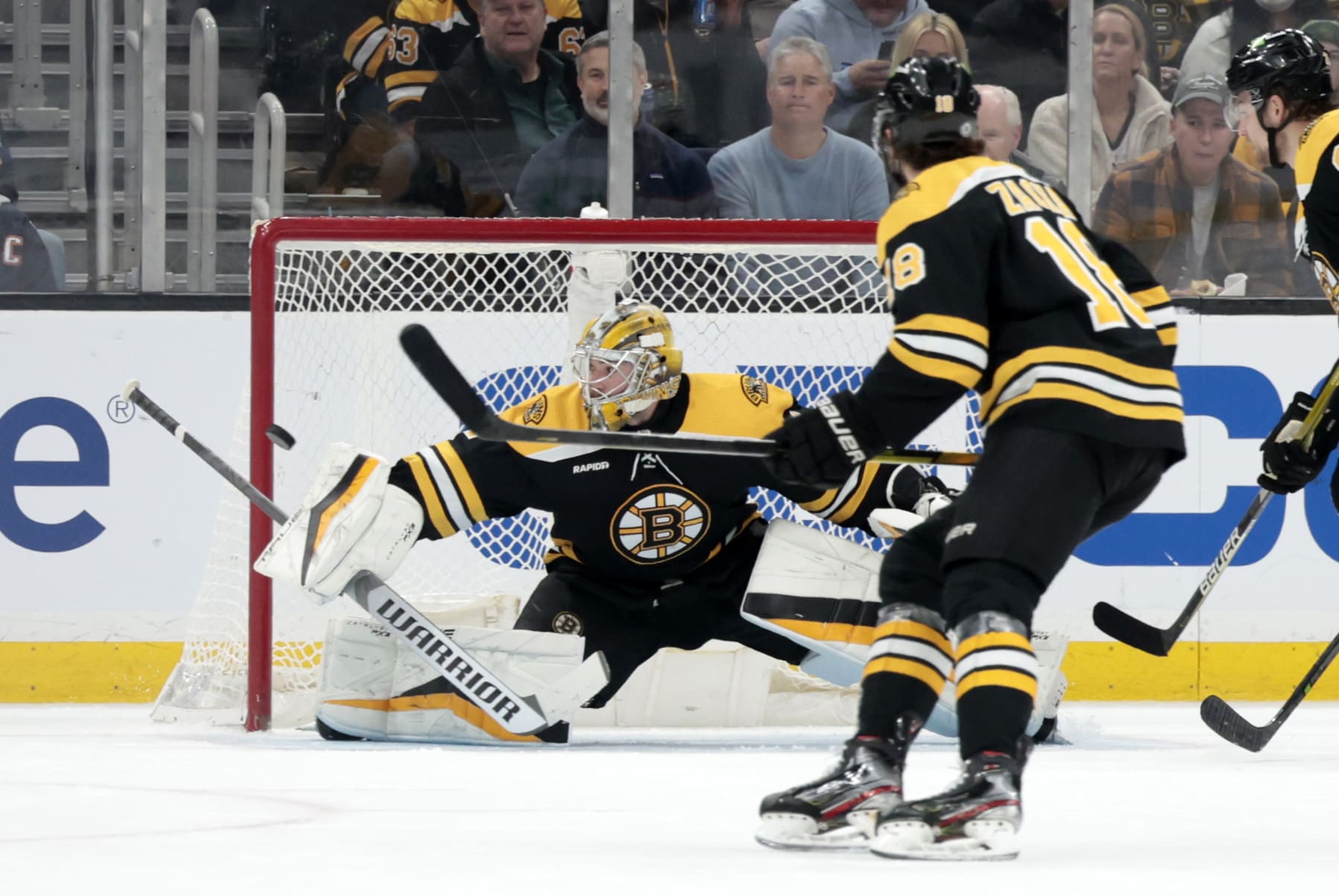 BOSTON, MA - MARCH 09: Boston Bruins goalie Jeremy Swayman (1) makes a blocker save during a game between the Boston Bruins and the Edmonton Oilers on March 9, 2023, at TD garden in Boston, Massachusetts. (Photo by Fred Kfoury III/Icon Sportswire via Getty Images)