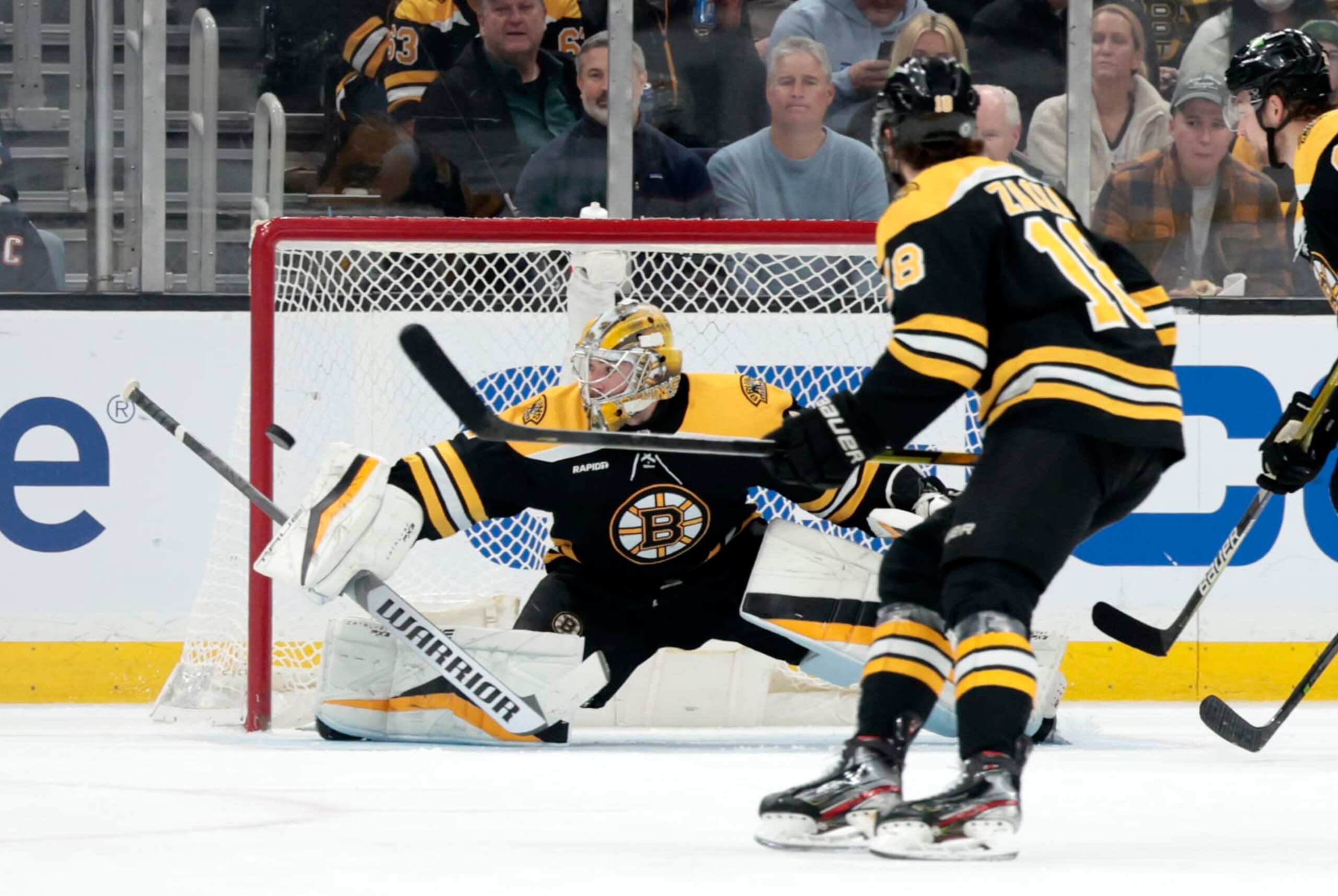 BOSTON, MA - MARCH 09: Boston Bruins goalie Jeremy Swayman (1) makes a blocker save during a game between the Boston Bruins and the Edmonton Oilers on March 9, 2023, at TD garden in Boston, Massachusetts. (Photo by Fred Kfoury III/Icon Sportswire via Getty Images)