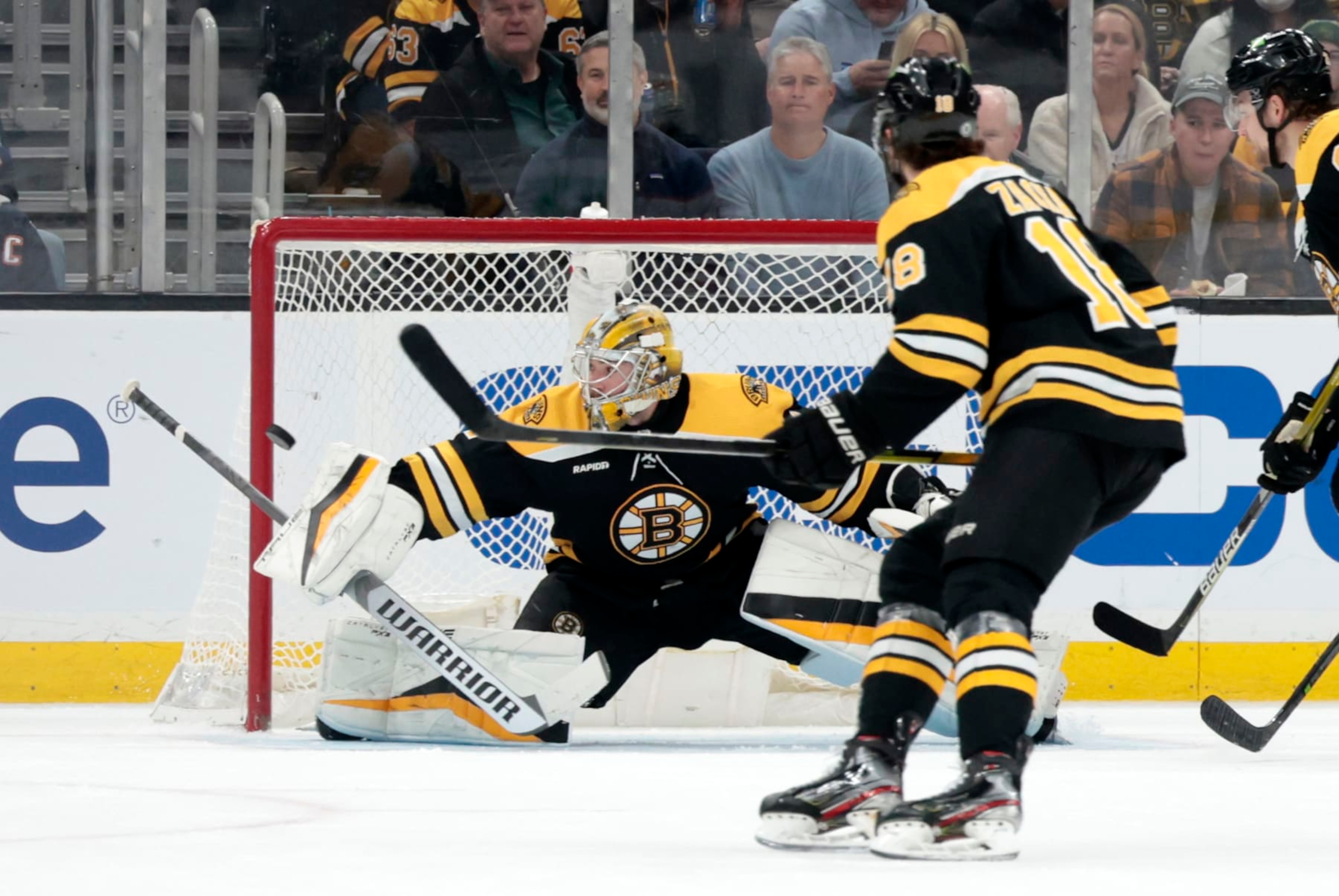 BOSTON, MA - MARCH 09: Boston Bruins goalie Jeremy Swayman (1) makes a blocker save during a game between the Boston Bruins and the Edmonton Oilers on March 9, 2023, at TD garden in Boston, Massachusetts. (Photo by Fred Kfoury III/Icon Sportswire via Getty Images)