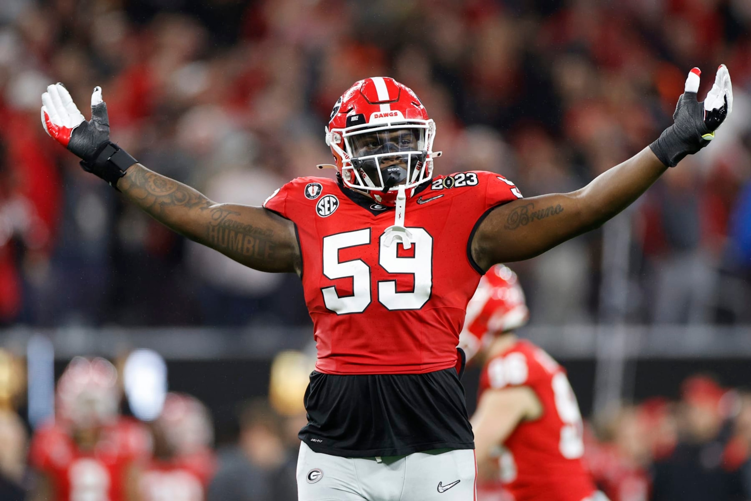 INGLEWOOD, CALIFORNIA - JANUARY 09: Broderick Jones #59 of the Georgia Bulldogs celebrates after a touchdown in the second quarter against the TCU Horned Frogs in the College Football Playoff National Championship game at SoFi Stadium on January 09, 2023 in Inglewood, California. (Photo by Steph Chambers/Getty Images)