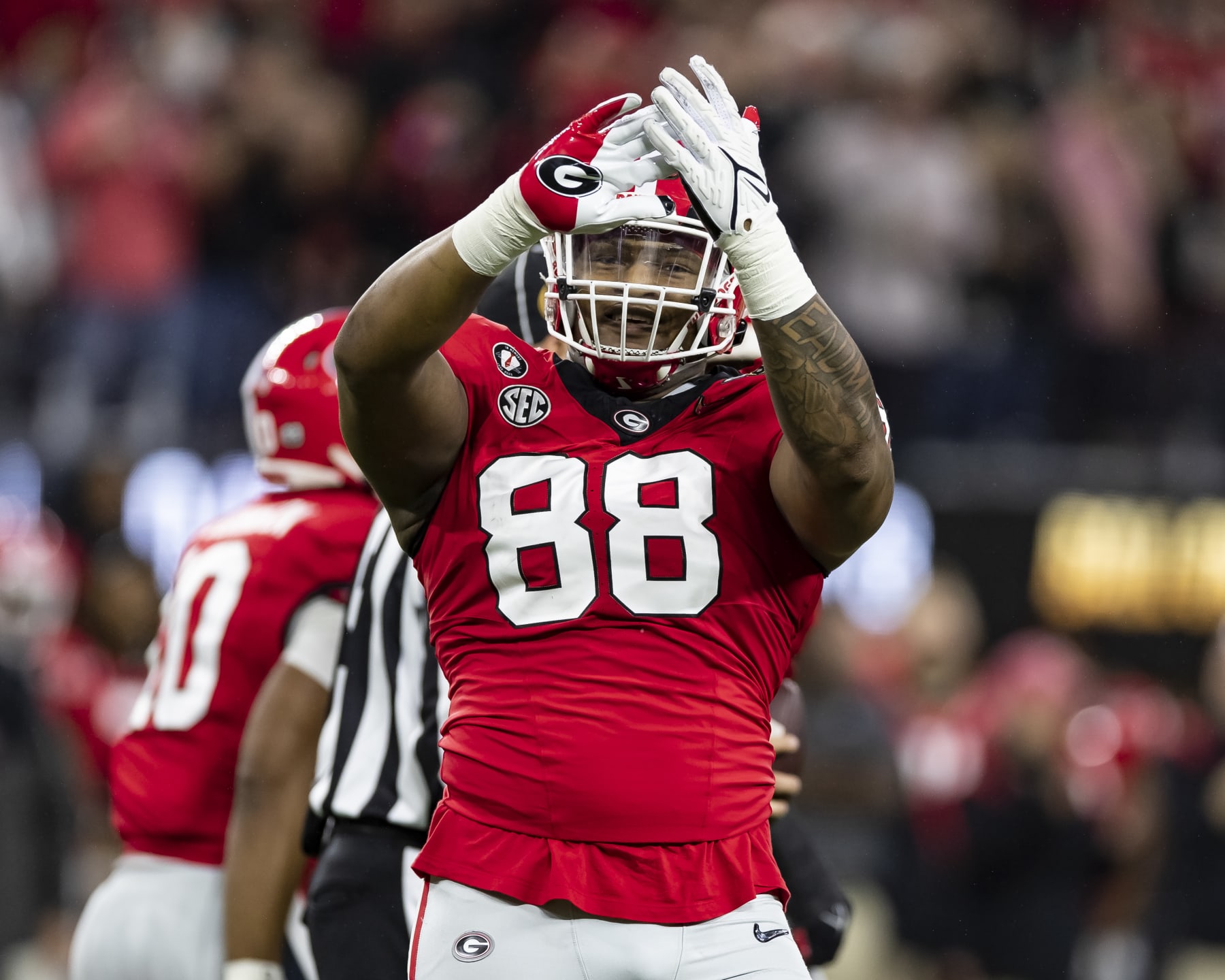 INGLEWOOD, CA - JANUARY 9: Jalen Carter #88 of the Georgia Bulldogs celebrates a big defensive play during a game between Texas Christian Horned Frogs and Georgia Bulldogs at SoFi Stadium on January 9, 2023 in Inglewood, California. (Photo by Steve Limentani/ISI Photos/Getty Images)