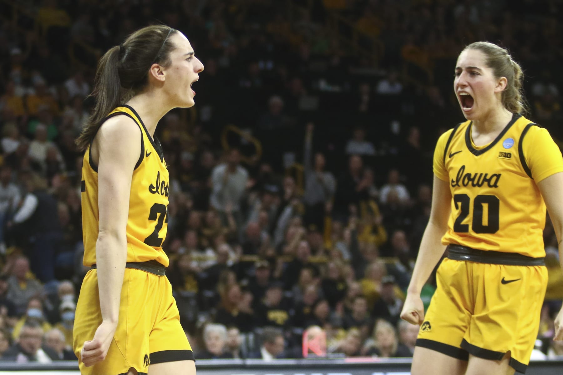 IOWA CITY, IOWA- MARCH 17:  Guard Caitlin Clark #22 of the Iowa Hawkeyes celebrates with guard Kate Martin after a basket against the Southeastern Louisiana Lady Lions in the first half during the first round of the NCAA Women's Basketball Tournament at Carver-Hawkeye Arena on March 17, 2023 in Iowa City, Iowa.  (Photo by Matthew Holst/Getty Images)