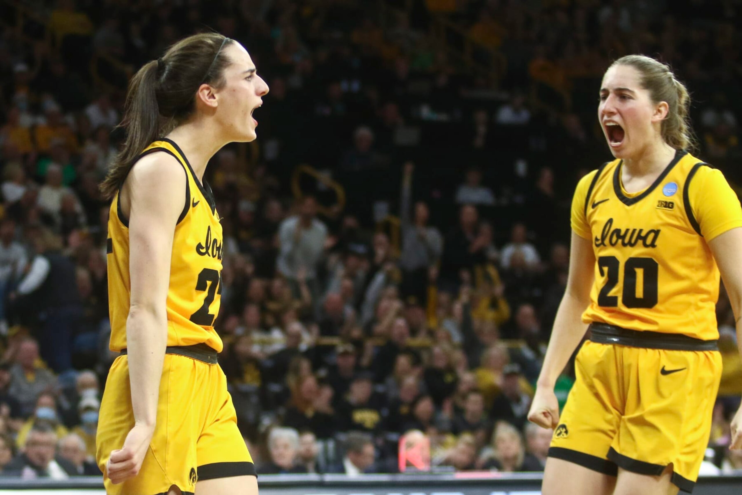 IOWA CITY, IOWA- MARCH 17:  Guard Caitlin Clark #22 of the Iowa Hawkeyes celebrates with guard Kate Martin after a basket against the Southeastern Louisiana Lady Lions in the first half during the first round of the NCAA Women's Basketball Tournament at Carver-Hawkeye Arena on March 17, 2023 in Iowa City, Iowa.  (Photo by Matthew Holst/Getty Images)