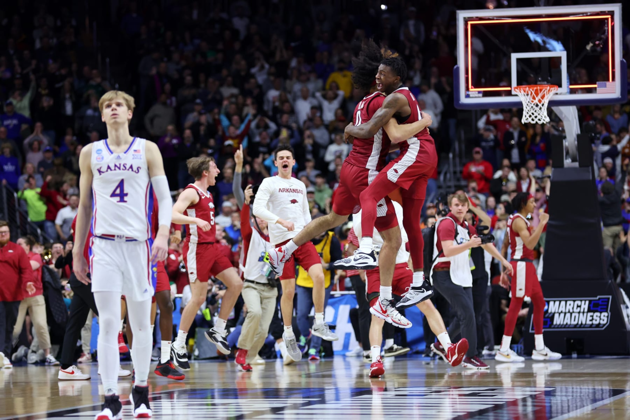 DES MOINES, IOWA - MARCH 18: Anthony Black #0 and Davonte Davis #4 of the Arkansas Razorbacks celebrate after defeating the Kansas Jayhawks in the second round of the NCAA Men's Basketball Tournament at Wells Fargo Arena on March 18, 2023 in Des Moines, Iowa. (Photo by Michael Reaves/Getty Images)