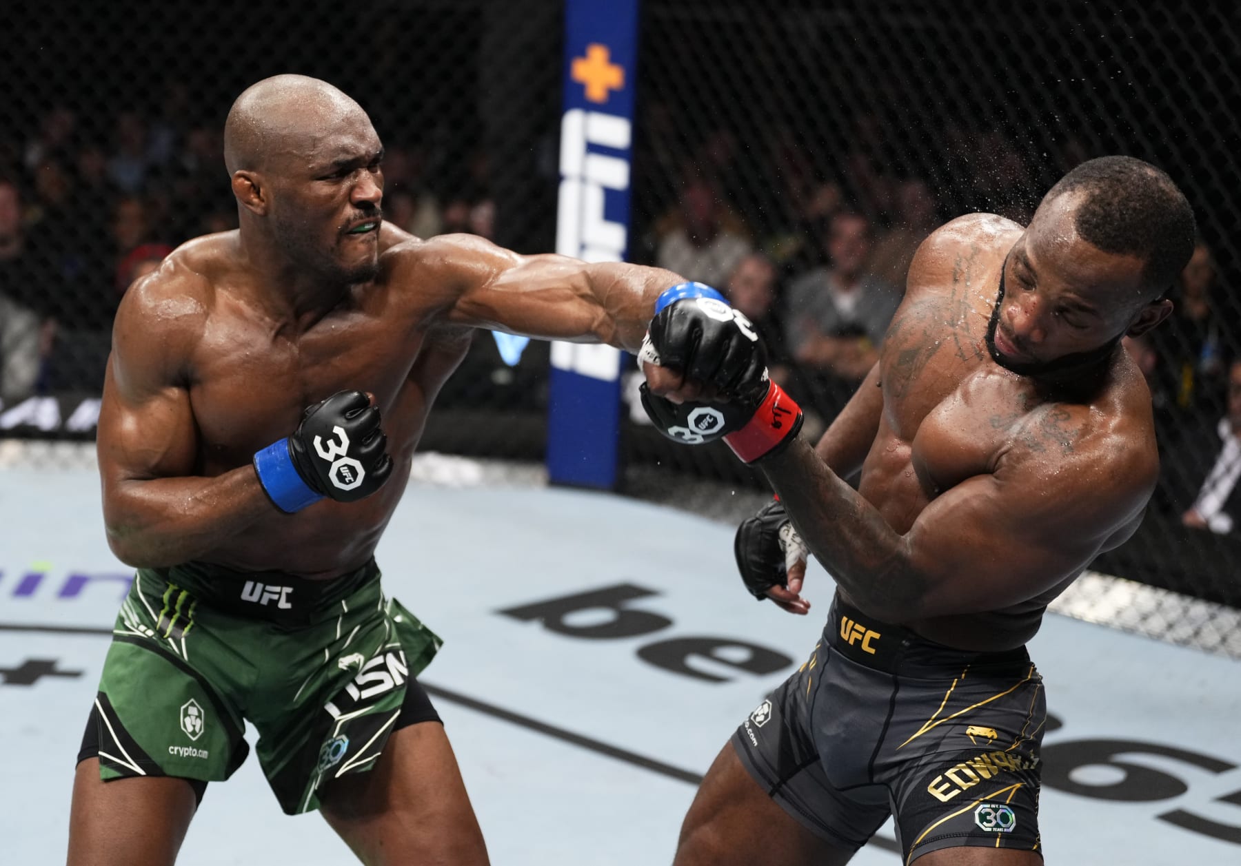 LONDON, ENGLAND - MARCH 18: (L-R) Kamaru Usman of Nigeria punches Leon Edwards of Jamaica in the UFC welterweight championship fight during the UFC 286 event at The O2 Arena on March 18, 2023 in London, England. (Photo by Jeff Bottari/Zuffa LLC via Getty Images)