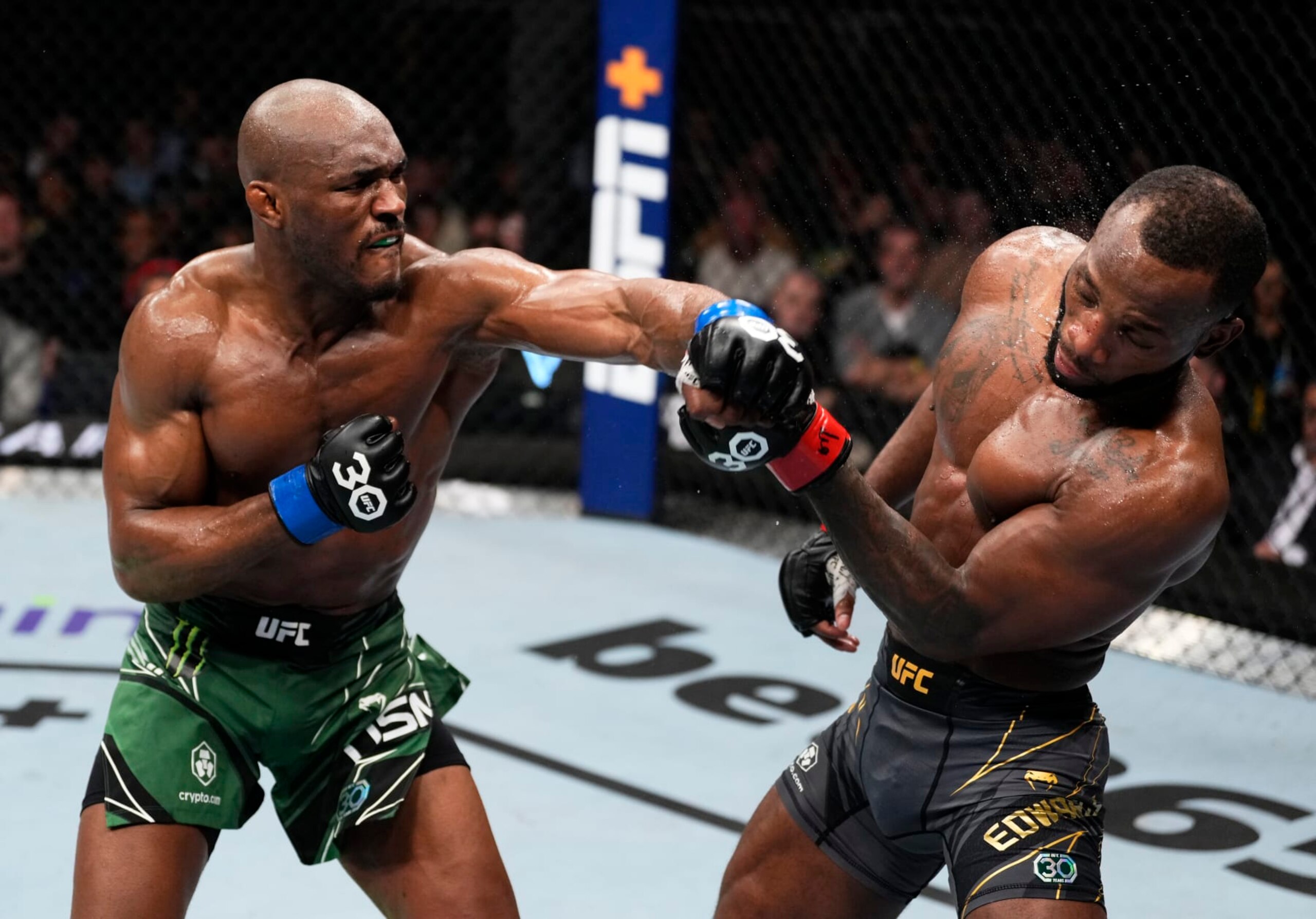 LONDON, ENGLAND - MARCH 18: (L-R) Kamaru Usman of Nigeria punches Leon Edwards of Jamaica in the UFC welterweight championship fight during the UFC 286 event at The O2 Arena on March 18, 2023 in London, England. (Photo by Jeff Bottari/Zuffa LLC via Getty Images)