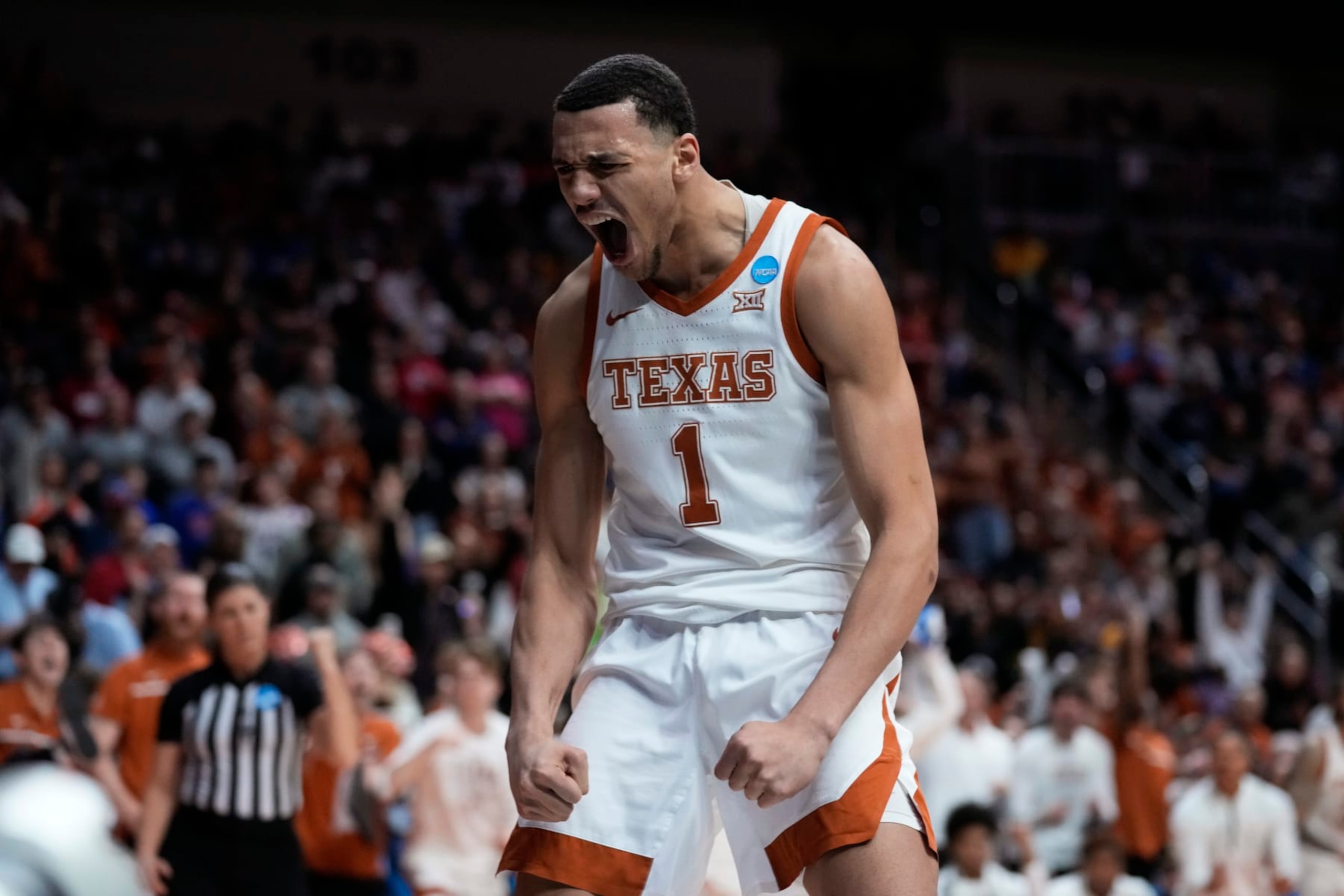 Texas forward Dylan Disu celebrates after making a basket in the second half of a first-round college basketball game against Colgate in the NCAA Tournament, Thursday, March 16, 2023, in Des Moines, Iowa. (AP Photo/Charlie Neibergall)