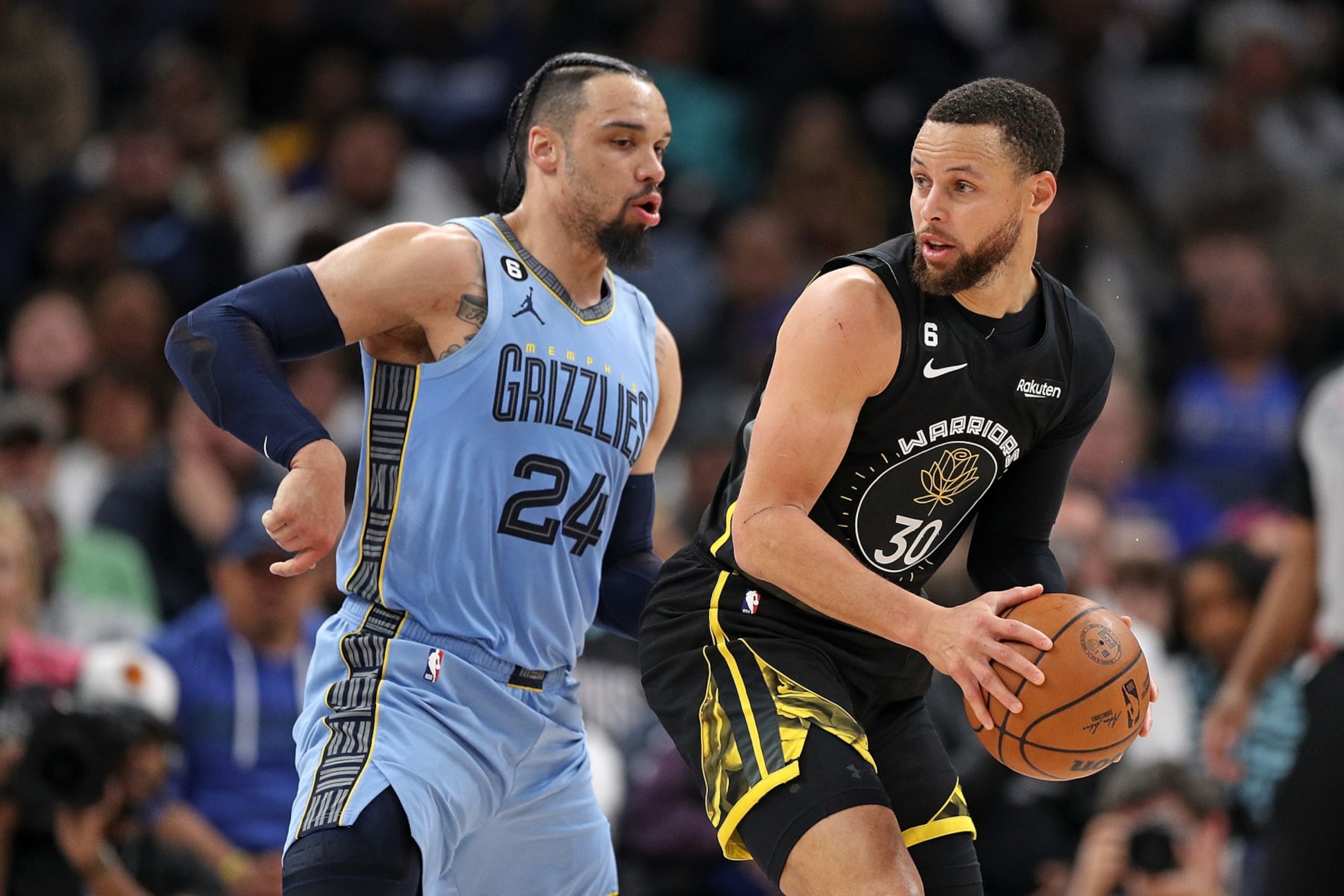 MEMPHIS, TENNESSEE - MARCH 18: Stephen Curry #30 of the Golden State Warriors handles the ball against Dillon Brooks #24 of the Memphis Grizzlies during the second half of the game at FedExForum on March 18, 2023 in Memphis, Tennessee. NOTE TO USER: User expressly acknowledges and agrees that, by downloading and or using this photograph, User is consenting to the terms and conditions of the Getty Images License Agreement. (Photo by Justin Ford/Getty Images)