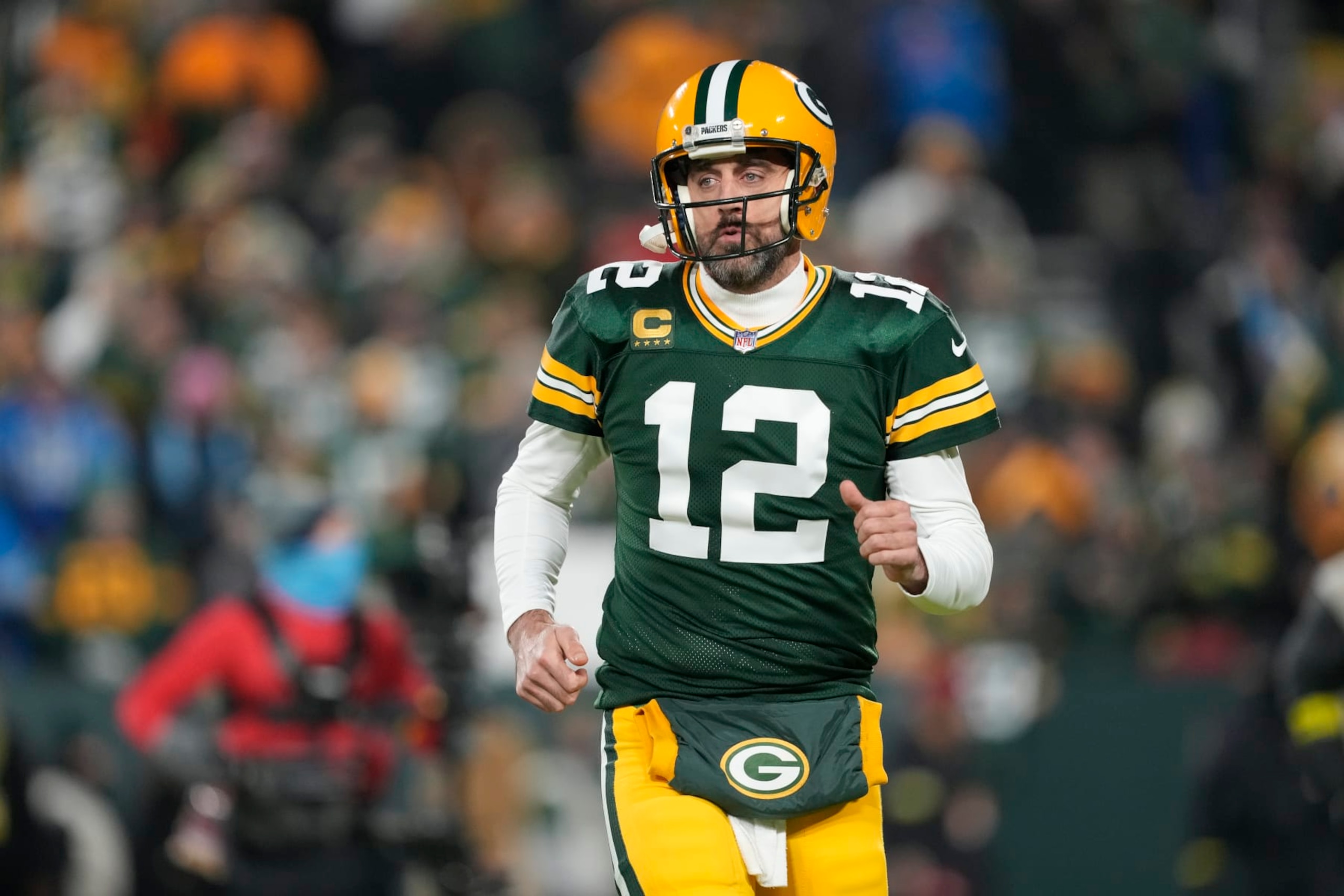 GREEN BAY, WISCONSIN - JANUARY 08: Aaron Rodgers #12 of the Green Bay Packers warms up prior to the game against the Detroit Lions at Lambeau Field on January 08, 2023 in Green Bay, Wisconsin. (Photo by Patrick McDermott/Getty Images) GREEN BAY, WISCONSIN - JANUARY 08: Aaron Rodgers #12 of the Green Bay Packers warms up prior to the game against the Detroit Lions at Lambeau Field on January 08, 2023 in Green Bay, Wisconsin. (Photo by Patrick McDermott/Getty Images)