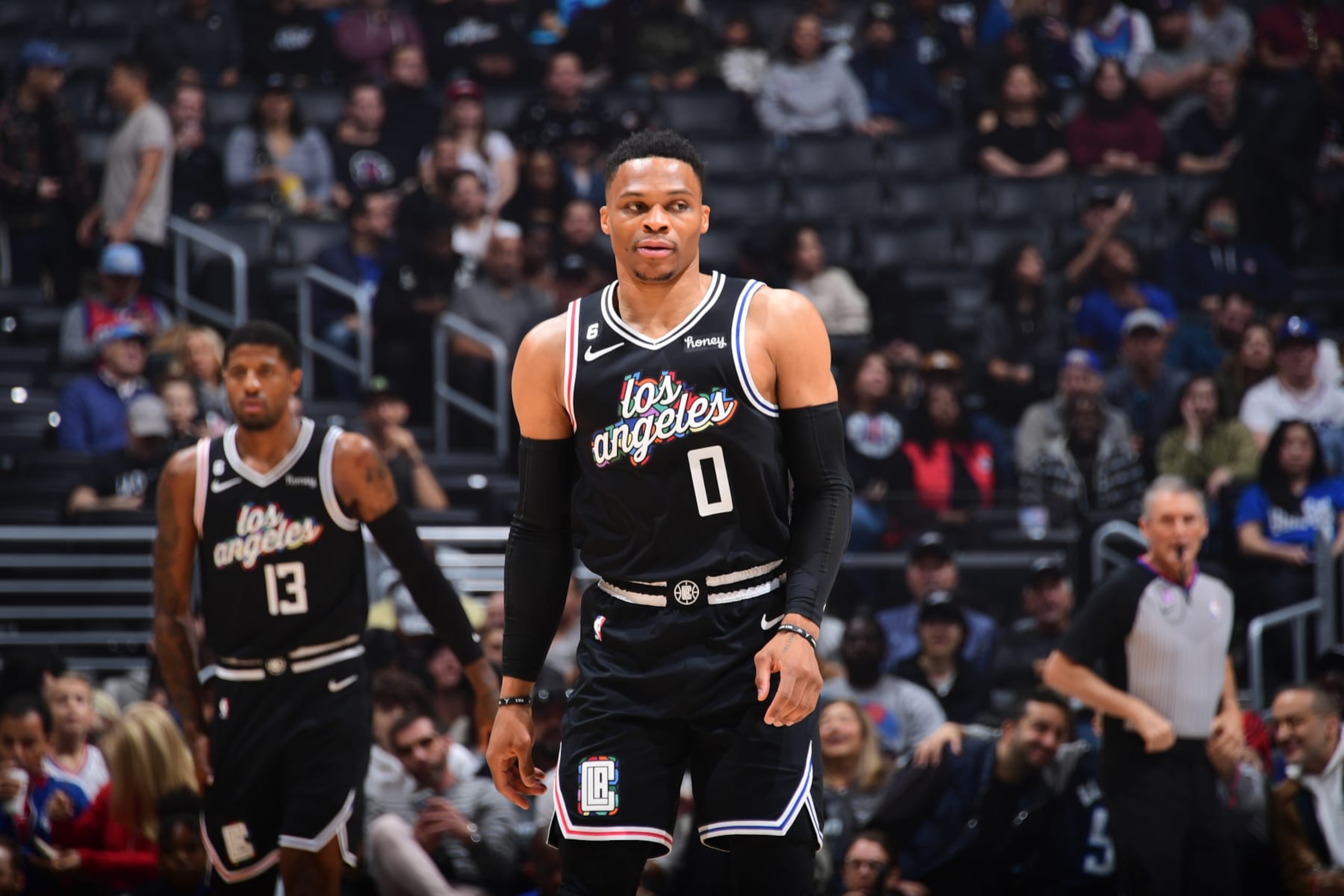 LOS ANGELES, CA - MARCH 18: Russell Westbrook  #0 of the LA Clippers and Paul George #13 look on during the game against the Orlando Magic on March 18, 2023 at Crypto.Com Arena in Los Angeles, California. NOTE TO USER: User expressly acknowledges and agrees that, by downloading and/or using this Photograph, user is consenting to the terms and conditions of the Getty Images License Agreement. Mandatory Copyright Notice: Copyright 2023 NBAE (Photo by Adam Pantozzi/NBAE via Getty Images)