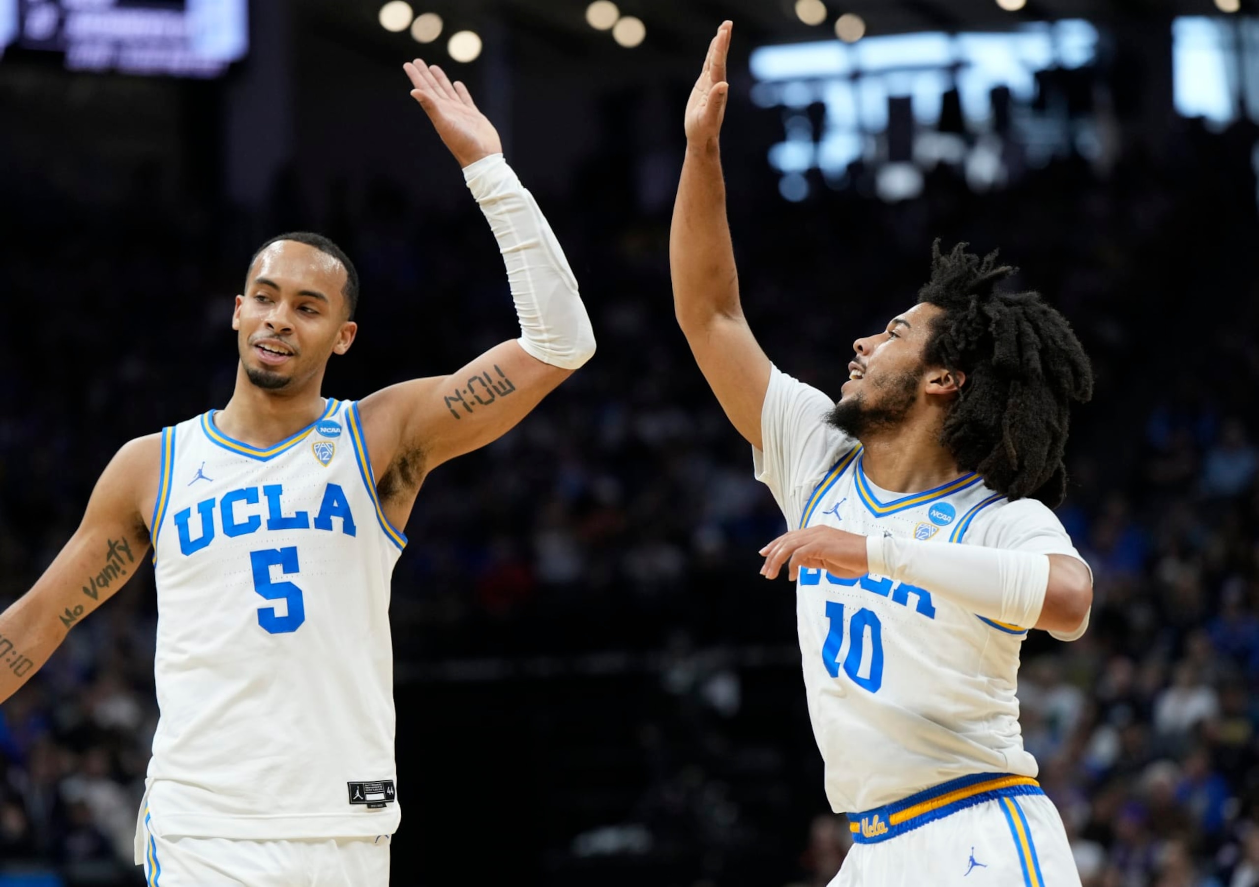 UCLA's Amari Bailey (5) and Tyger Campbell (10)