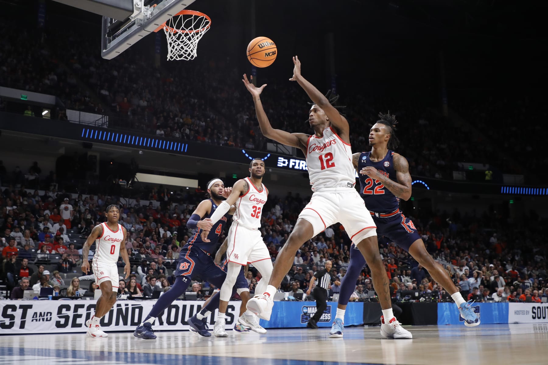 BIRMINGHAM, ALABAMA - MARCH 18: Tramon Mark #12 of the Houston Cougars rebounds the ball against Allen Flanigan #22 of the Auburn Tigers during the first half in the second round of the NCAA Men's Basketball Tournament at Legacy Arena at the BJCC on March 18, 2023 in Birmingham, Alabama. (Photo by Alex Slitz/Getty Images)