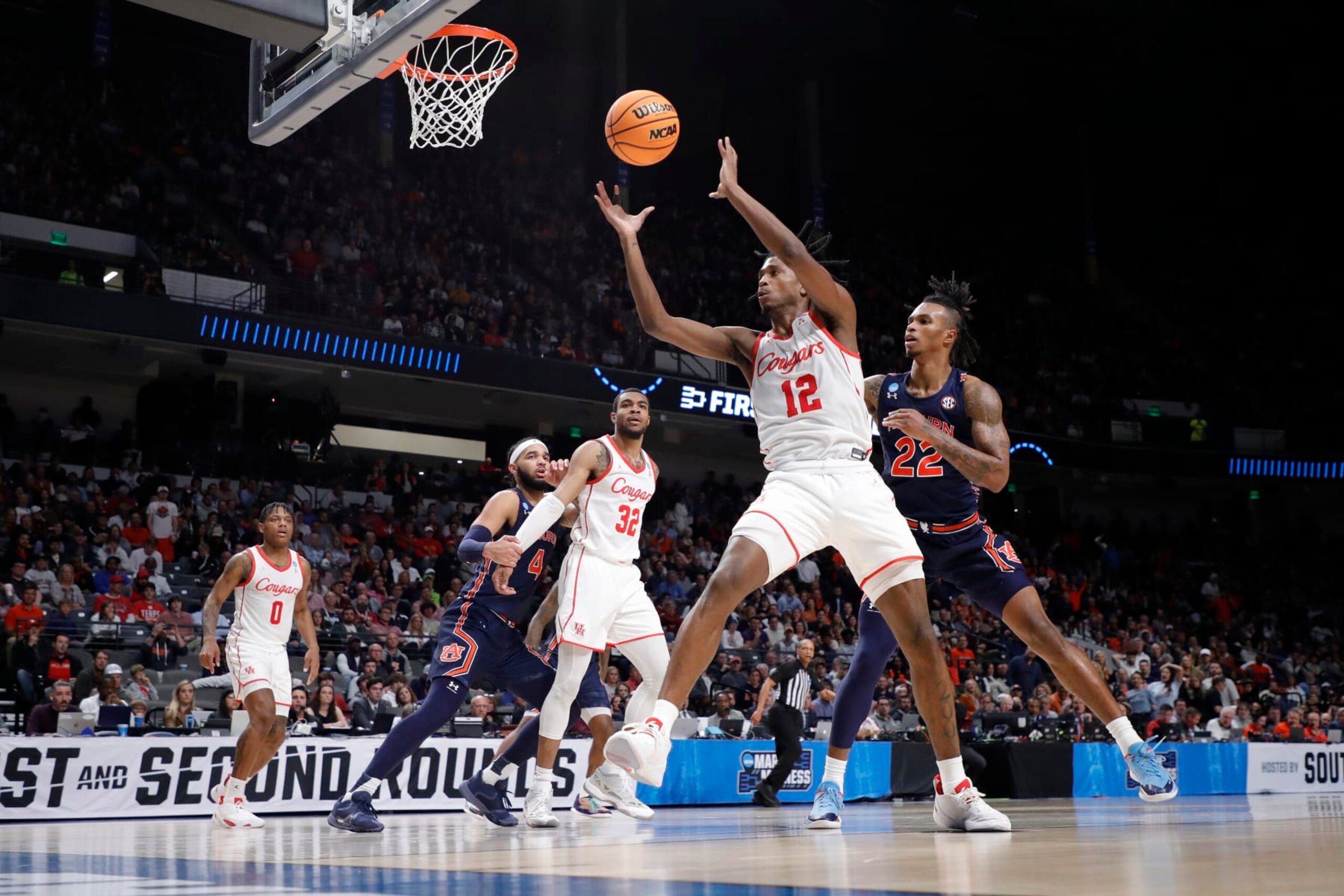 BIRMINGHAM, ALABAMA - MARCH 18: Tramon Mark #12 of the Houston Cougars rebounds the ball against Allen Flanigan #22 of the Auburn Tigers during the first half in the second round of the NCAA Men's Basketball Tournament at Legacy Arena at the BJCC on March 18, 2023 in Birmingham, Alabama. (Photo by Alex Slitz/Getty Images)