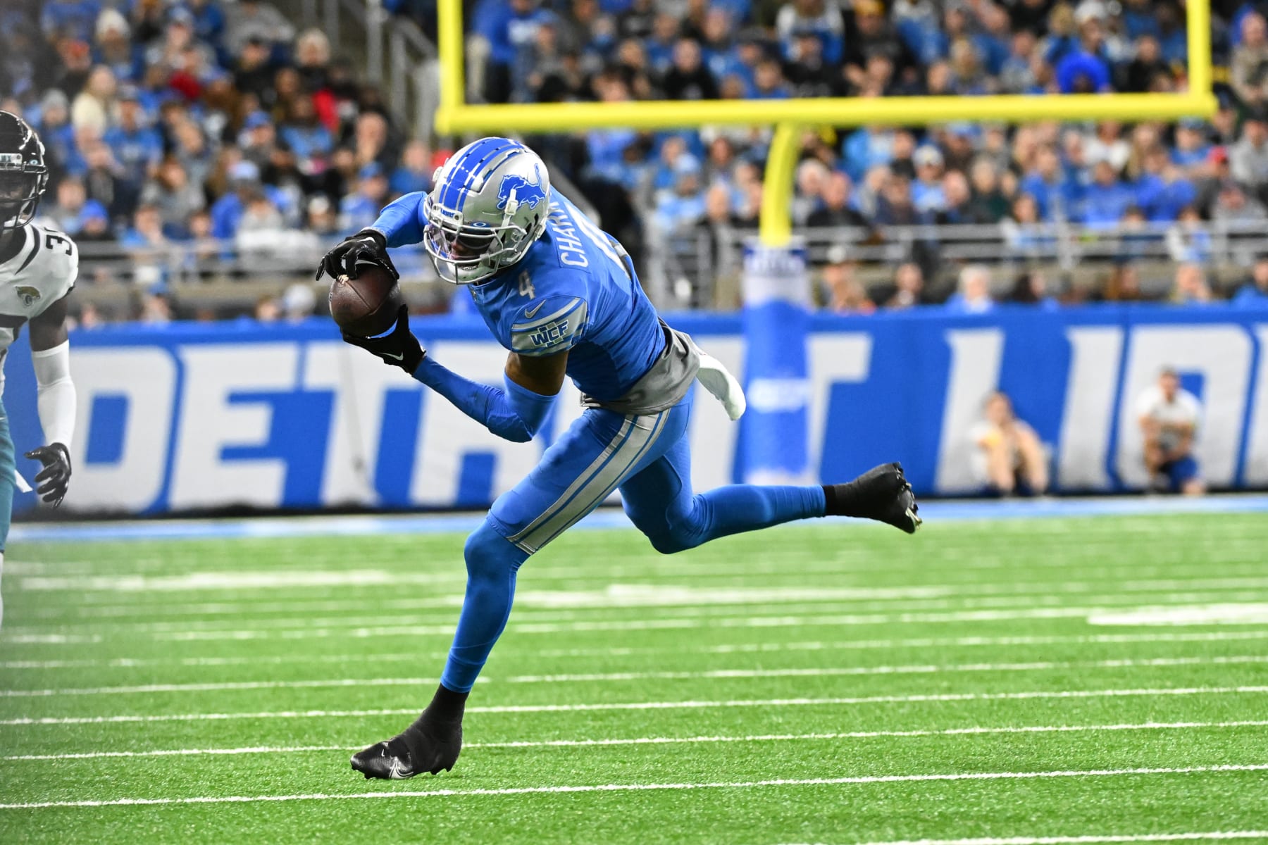 DETROIT, MI - DECEMBER 04: Detroit Lions wide receiver DJ Chark (4) makes a catch near the sidelines for a first down during to the Detroit Lions versus the Jacksonville Jaguars game on Sunday December 4, 2022 at Ford Field in Detroit, MI. (Photo by Steven King/Icon Sportswire via Getty Images)