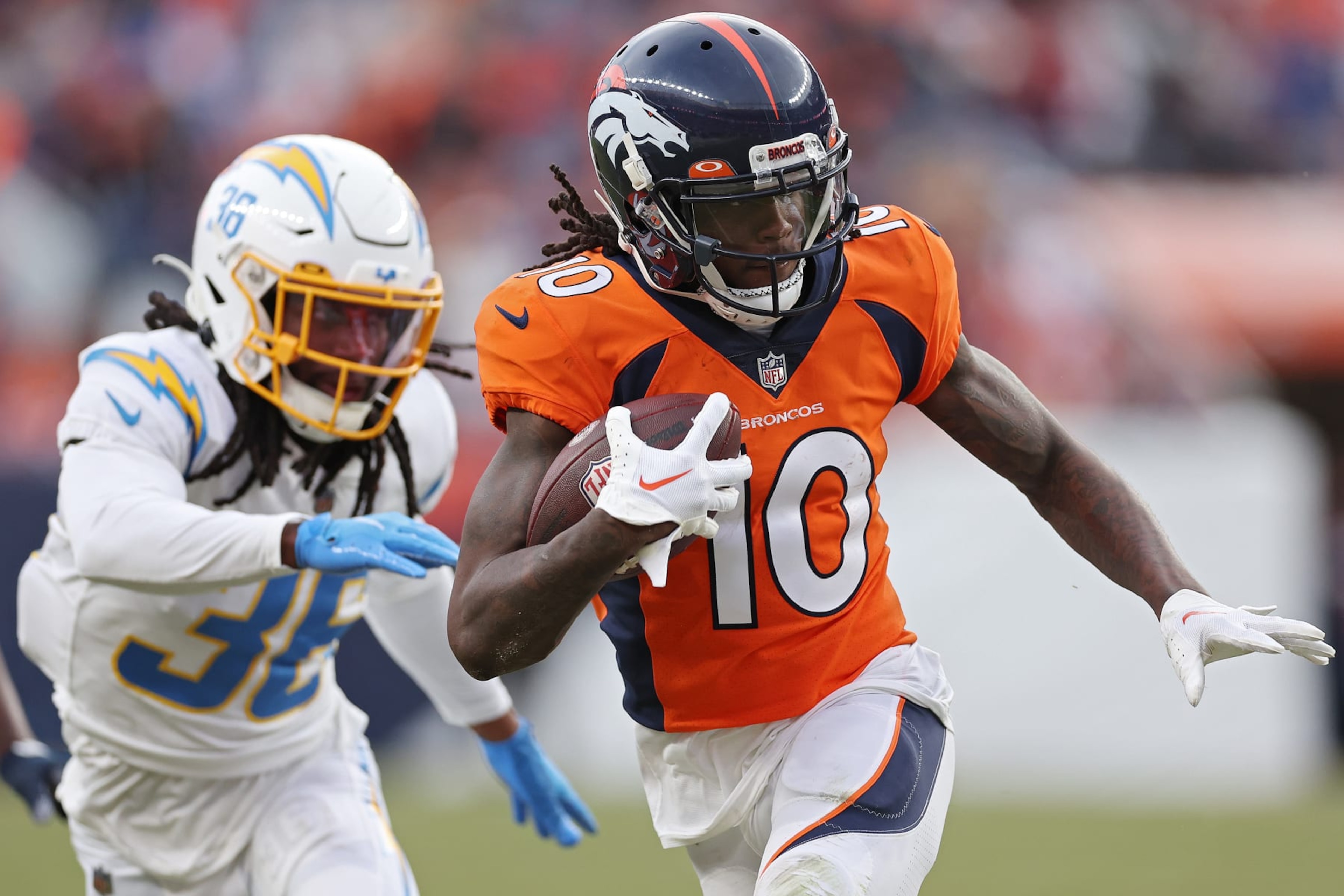 DENVER, COLORADO - JANUARY 08: Jerry Jeudy #10 of the Denver Broncos runs past Ja'Sir Taylor #36 of the Los Angeles Chargers during the third quarter at Empower Field At Mile High on January 08, 2023 in Denver, Colorado. (Photo by Matthew Stockman/Getty Images) DENVER, COLORADO - JANUARY 08: Jerry Jeudy #10 of the Denver Broncos runs past Ja'Sir Taylor #36 of the Los Angeles Chargers during the third quarter at Empower Field At Mile High on January 08, 2023 in Denver, Colorado. (Photo by Matthew Stockman/Getty Images)