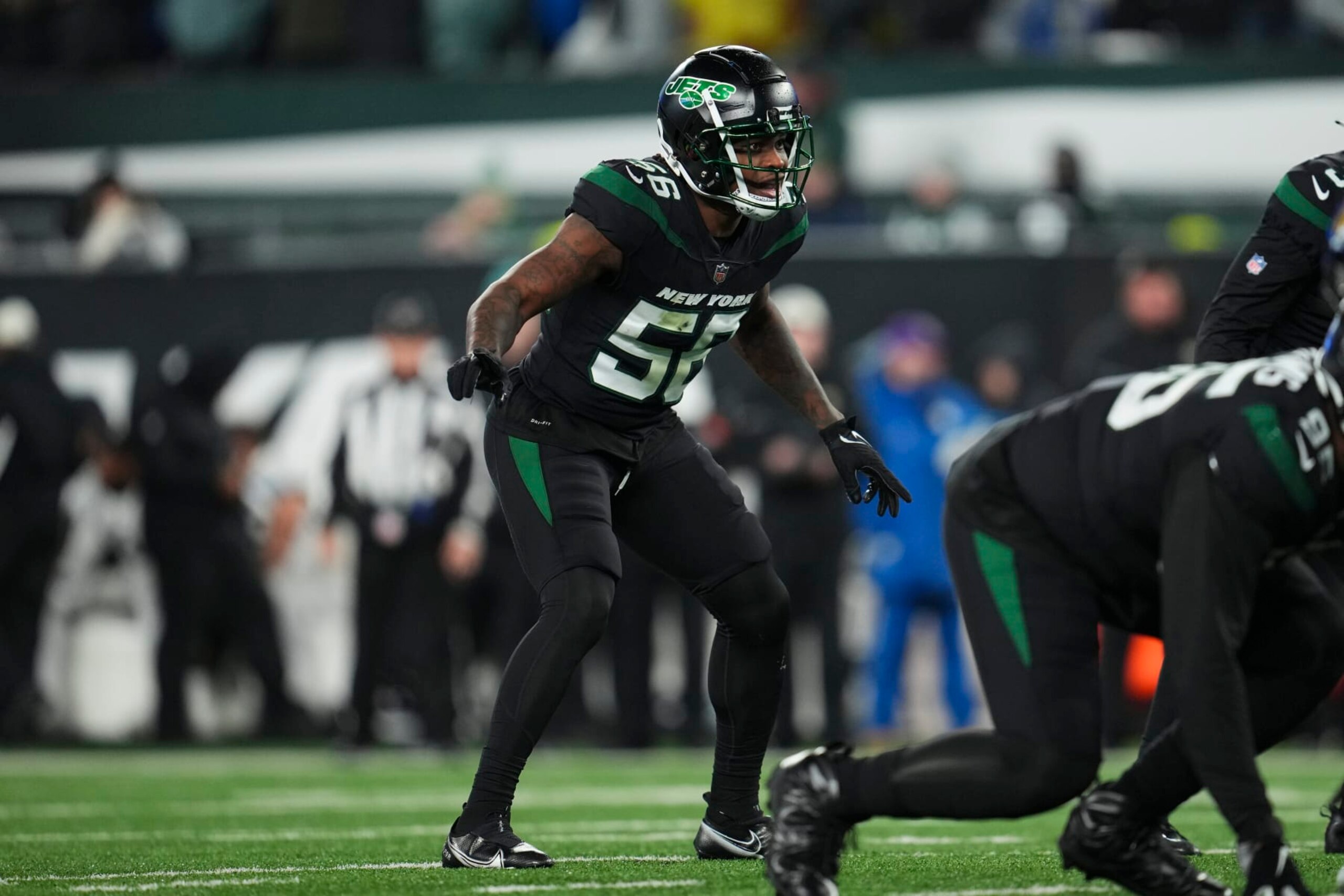 EAST RUTHERFORD, NJ - DECEMBER 22: Quincy Williams #56 of the New York Jets gets set against the Jacksonville Jaguars at MetLife Stadium on December 22, 2022 in East Rutherford, New Jersey. (Photo by Cooper Neill/Getty Images)