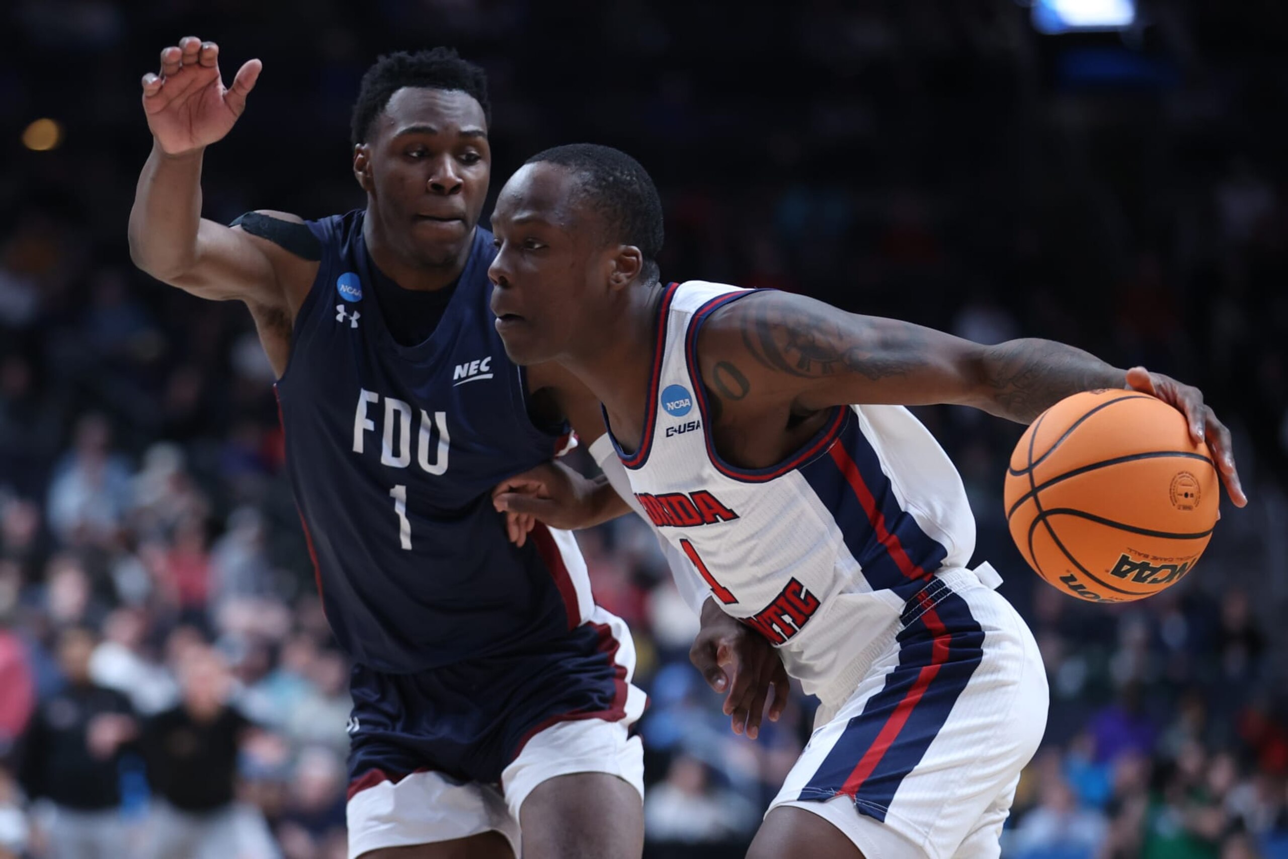 FDU's Joe Munden and FAU's Johnell Davis