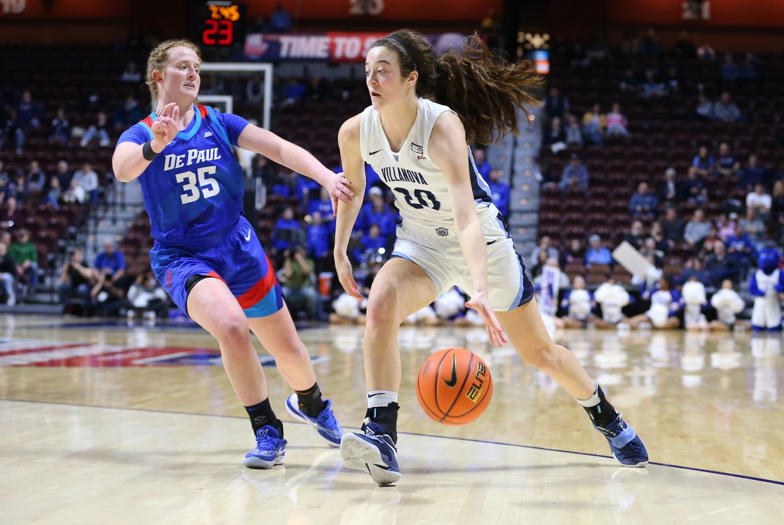 UNCASVILLE, CT - MARCH 04: Villanova Wildcats forward Maddy Siegrist (20) drives past DePaul Blue Demons guard Kendall Holmes (35) during the Big East Women's Basketball Tournament game between DePaul Blue Demons and Villanova Wildcats on March 4, 2023, at Mohegan Sun Arena in Uncasville, CT. (Photo by M. Anthony Nesmith/Icon Sportswire via Getty Images)