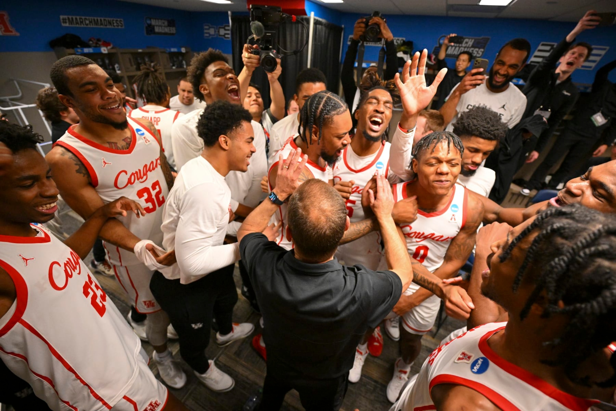 BIRMINGHAM, AL - MARCH 18: Marcus Sasser #0, Head Coach Kelvin Sampson and the Houston Cougars celebrate after win against the Auburn Tigers during the second round of the 2023 NCAA Men's Basketball Tournament held at Legacy Arena at the BJCC on March 18, 2023 in Birmingham, Alabama. (Photo by Andy Hancock/NCAA Photos via Getty Images)
