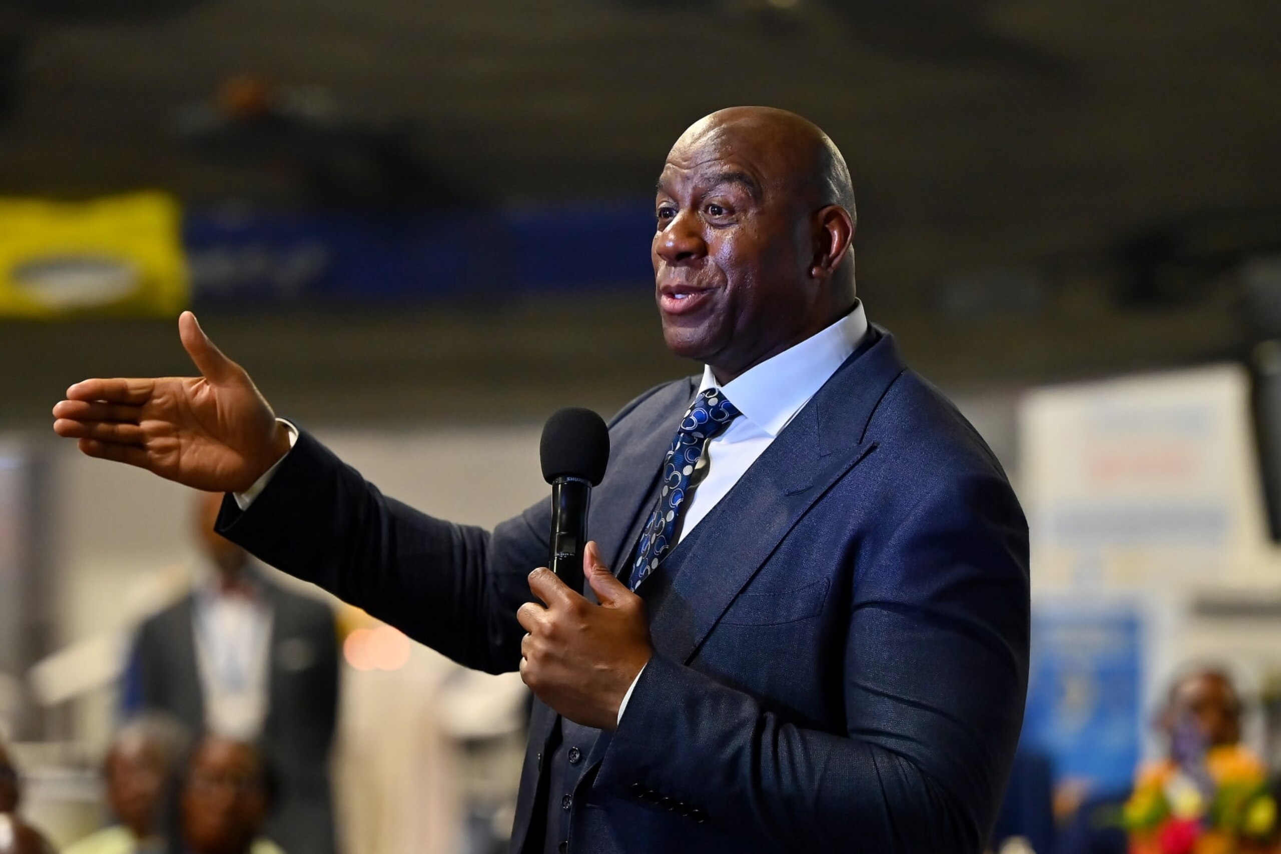 ATLANTA, GEORGIA - MARCH 17: Magic Johnson speaks during the 2023 International Poverty Forum at Delta Flight Museum on March 17, 2023 in Atlanta, Georgia. (Photo by Derek White/Getty Images)