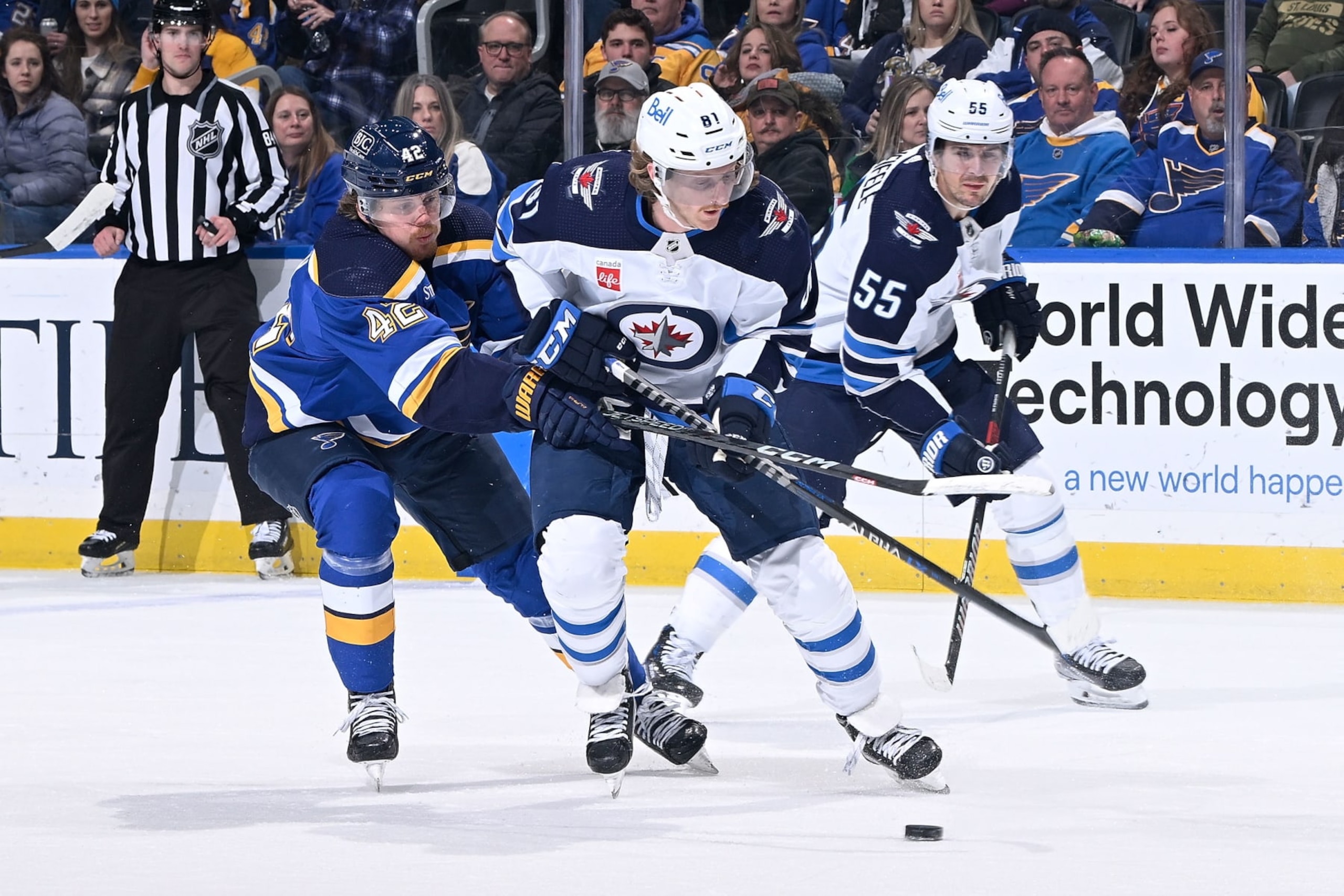 ST. LOUIS, MO - MARCH 19: Kasperi Kapanen #42 of the St. Louis Blues defends against Kyle Connor #81 of the Winnipeg Jets at the Enterprise Center on March 19, 2023 in St. Louis, Missouri. (Photo by Scott RovakNHLI via Getty Images)