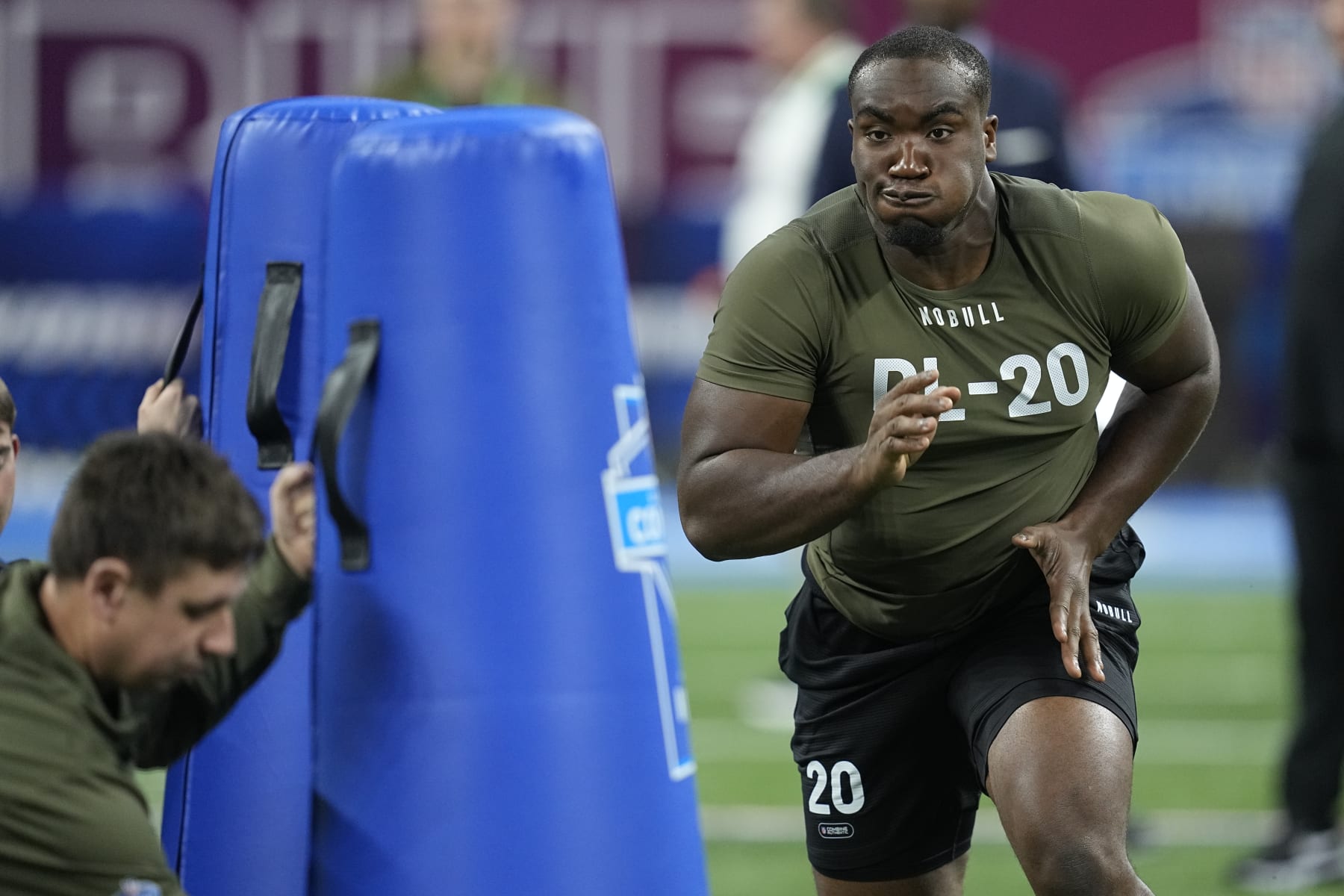 Northwestern defensive lineman Adetomiwa Adebawore runs a drill at the NFL football scouting combine in Indianapolis, Thursday, March 2, 2023. (AP Photo/Darron Cummings)
