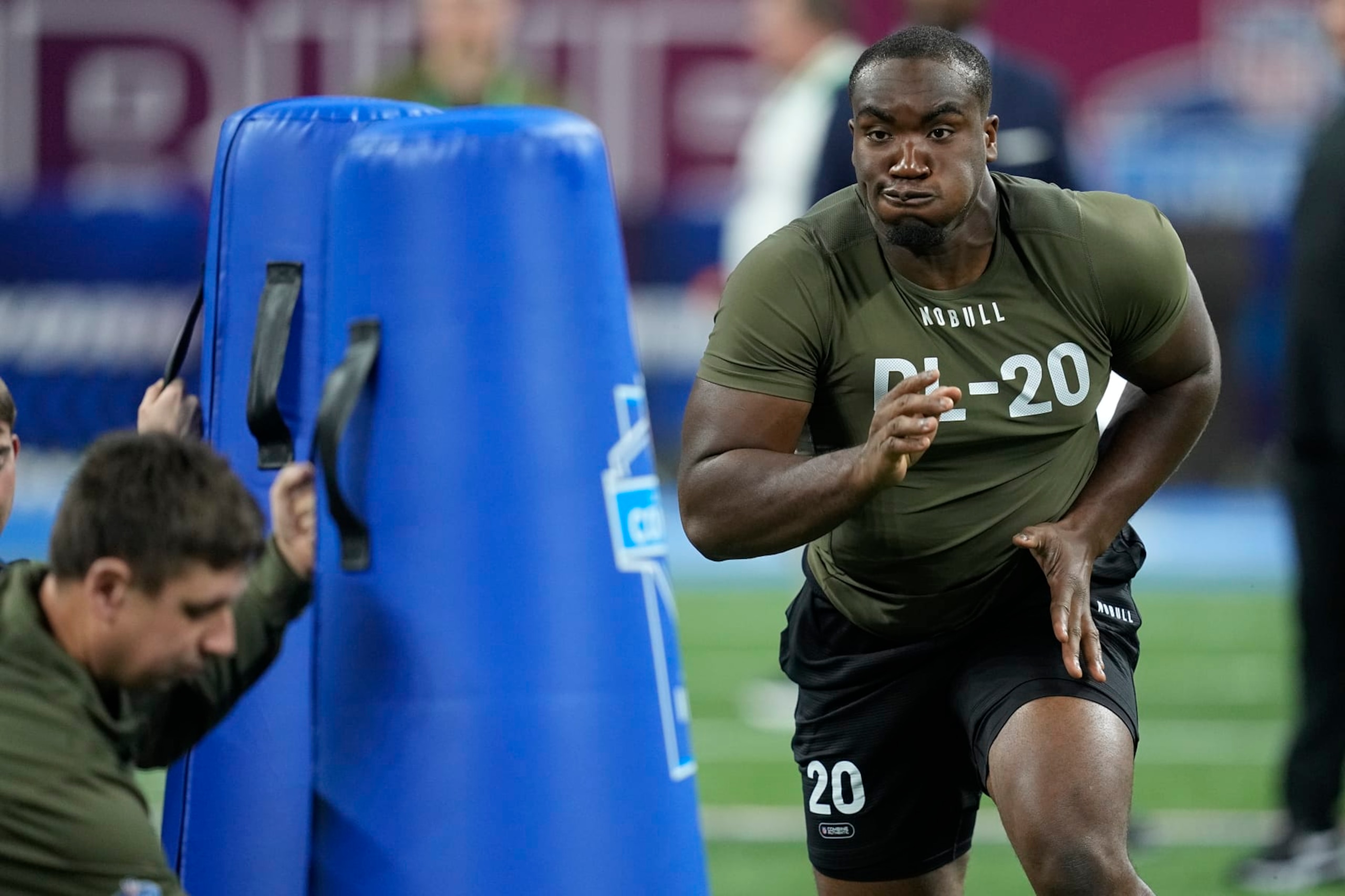 Northwestern defensive lineman Adetomiwa Adebawore runs a drill at the NFL football scouting combine in Indianapolis, Thursday, March 2, 2023. (AP Photo/Darron Cummings)