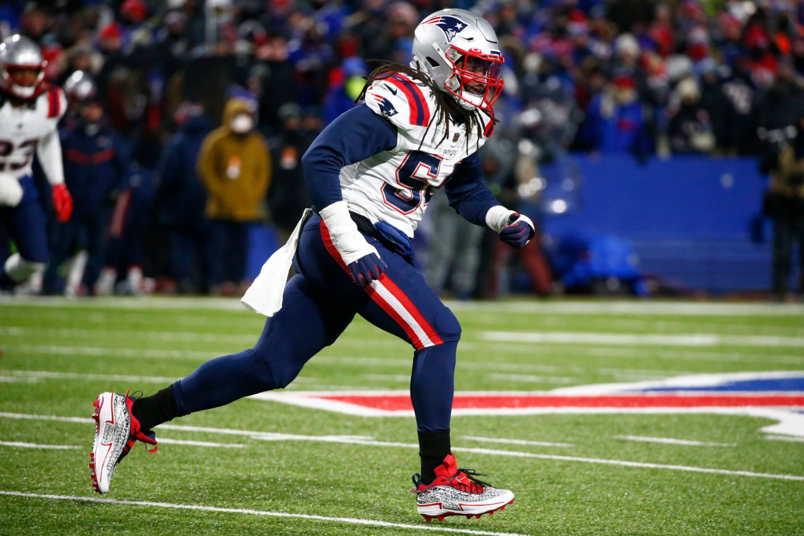 New England Patriots outside linebacker Dont'a Hightower (54) runs during the second half of an NFL wild-card playoff football game against the Buffalo Bills in Orchard Park, N.Y., Saturday, Jan. 15, 2022. (AP Photo/ Jeffrey T. Barnes) New England Patriots outside linebacker Dont'a Hightower (54) runs during the second half of an NFL wild-card playoff football game against the Buffalo Bills in Orchard Park, N.Y., Saturday, Jan. 15, 2022. (AP Photo/ Jeffrey T. Barnes)