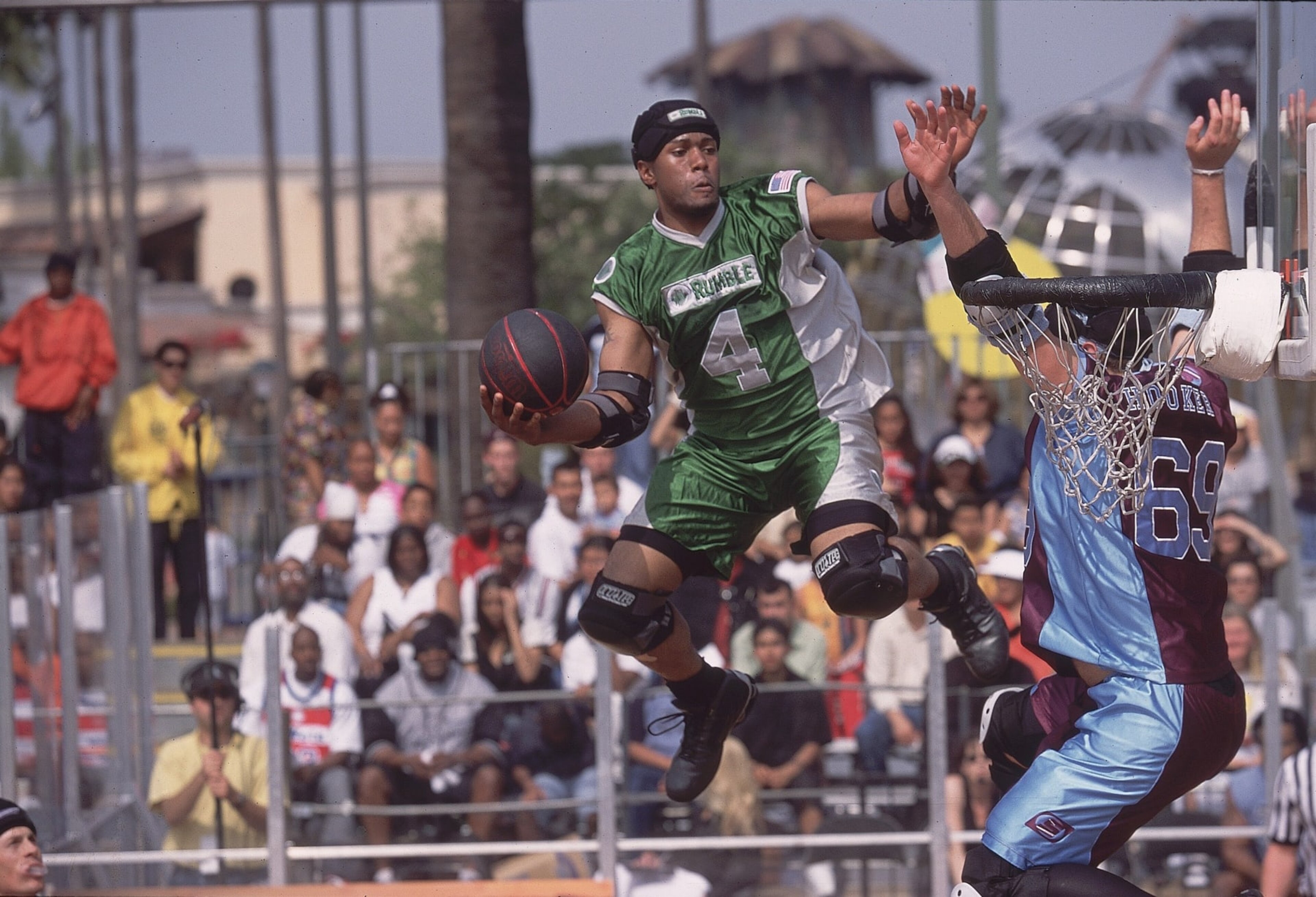 UNITED STATES - MAY 17:  SlamBall: Rumble's Jelani Janisse (4) in action vs Slashers Adam Hooker (69), Los Angeles, CA 5/17/2003  (Photo by Robert Beck/Sports Illustrated via Getty Images)  (SetNumber: X68385 TK3 R7 F1)