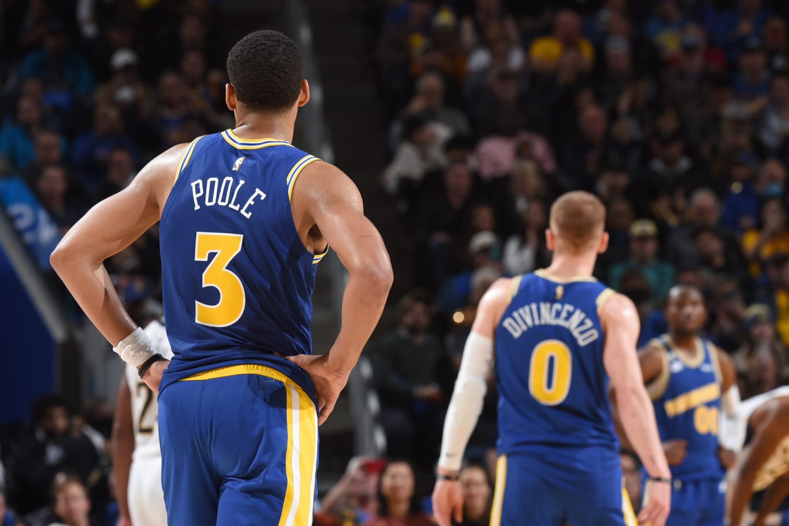 SAN FRANCISCO, CA - DECEMBER 5: Jordan Poole #3 of the Golden State Warriors and Donte DiVincenzo #0 look on during the game against the Indiana Pacers on December 5, 2022 at Chase Center in San Francisco, California. NOTE TO USER: User expressly acknowledges and agrees that, by downloading and or using this photograph, user is consenting to the terms and conditions of Getty Images License Agreement. Mandatory Copyright Notice: Copyright 2022 NBAE (Photo by Noah Graham/NBAE via Getty Images)