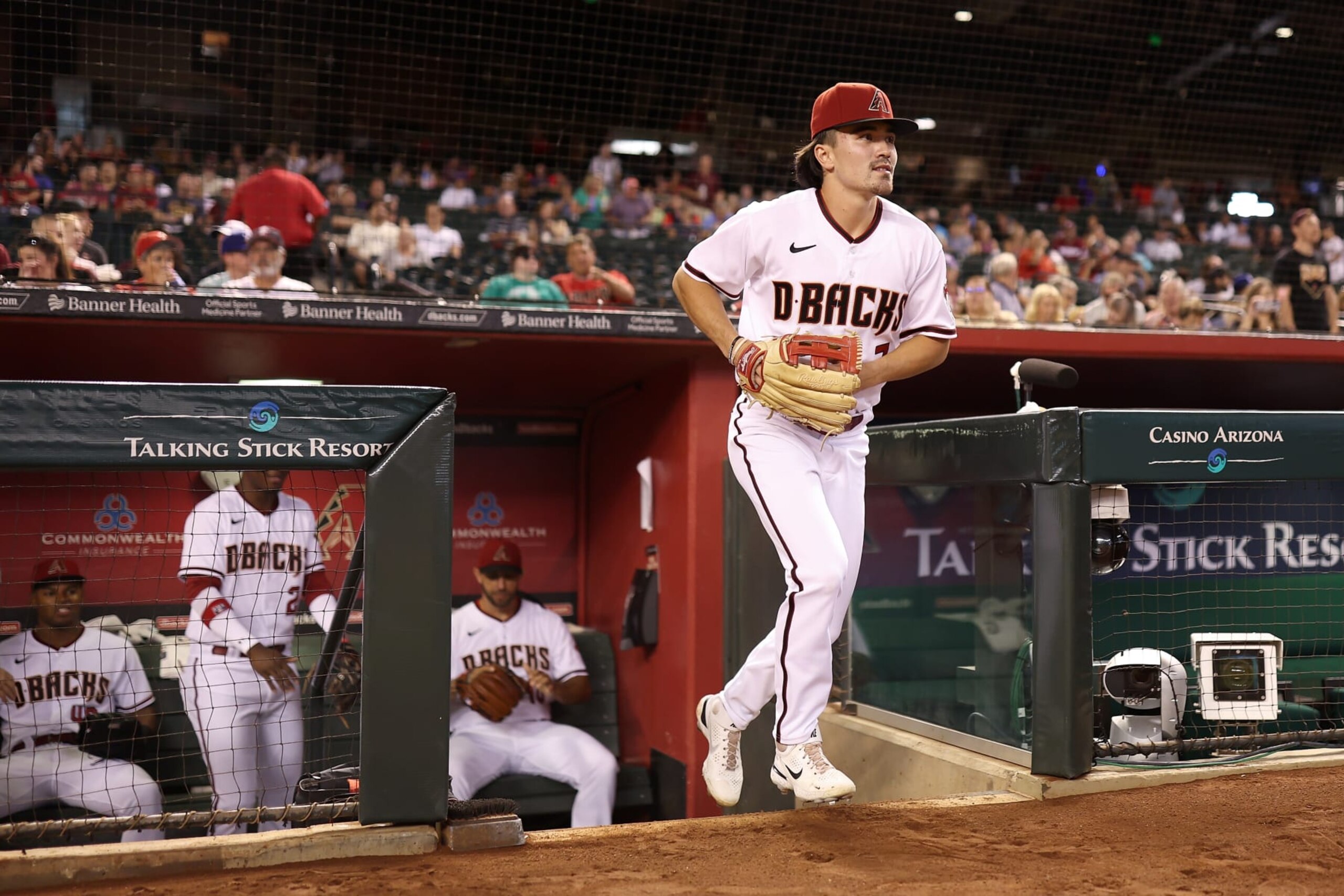 PHOENIX, ARIZONA - AUGUST 29: Outfielder Corbin Carroll #7 of the Arizona Diamondbacks runs onto the field during the first inning of the MLB game against the Philadelphia Phillies at Chase Field on August 29, 2022 in Phoenix, Arizona. (Photo by Christian Petersen/Getty Images)
