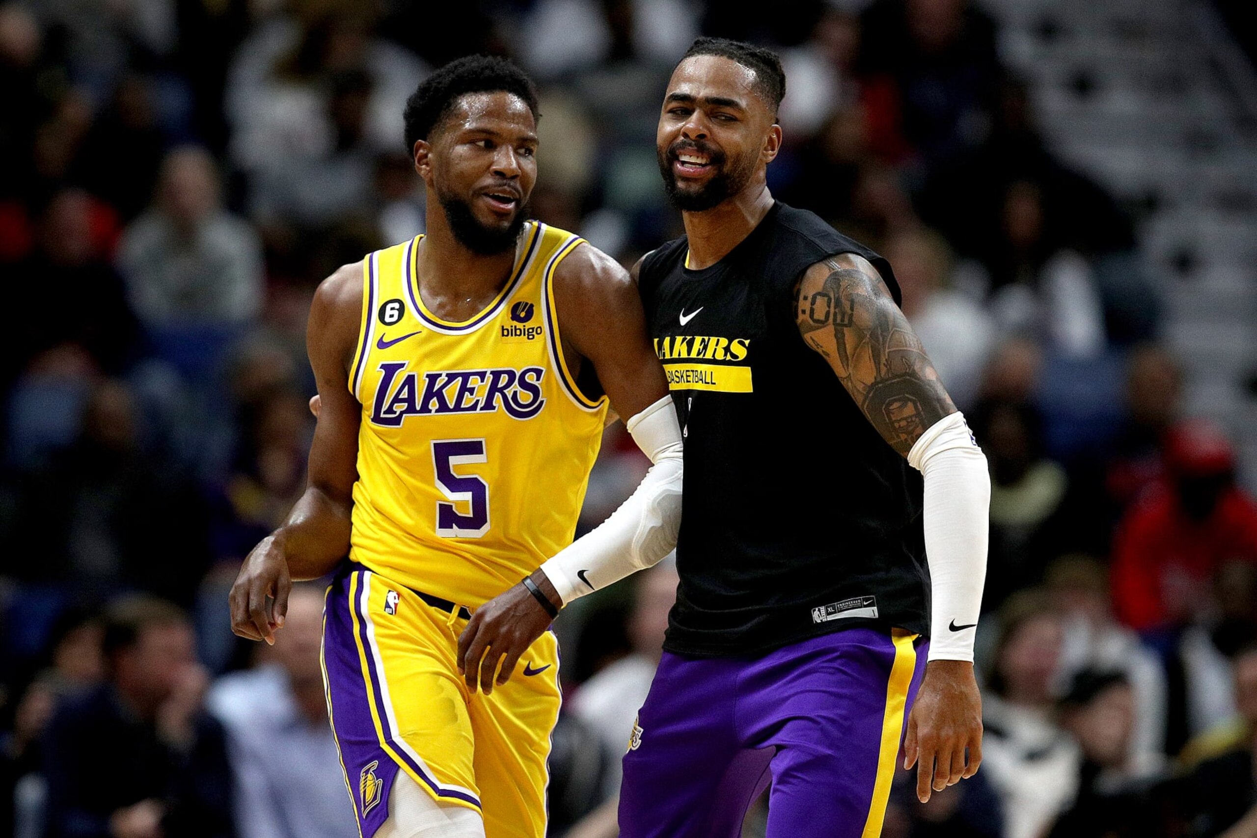 NEW ORLEANS, LOUISIANA - MARCH 14: Malik Beasley #5 of the Los Angeles Lakers reacts with D'Angelo Russell #1 of the Los Angeles Lakers after scoring a three point basket  during the first quarter of an NBA game against the New Orleans Pelicans at Smoothie King Center on March 14, 2023 in New Orleans, Louisiana.  NOTE TO USER: User expressly acknowledges and agrees that, by downloading and or using this photograph, User is consenting to the terms and conditions of the Getty Images License Agreement. (Photo by Sean Gardner/Getty Images)
