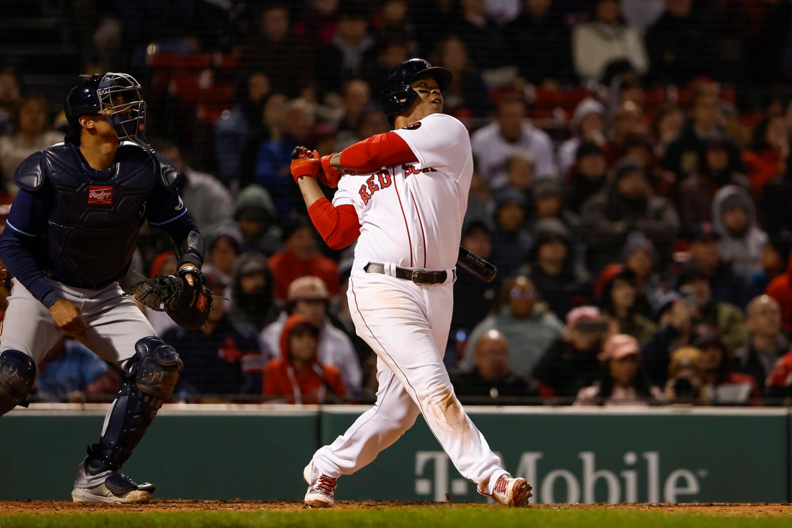 BOSTON, MA - OCTOBER 3: Rafael Devers #11 of the Boston Red Sox follows through on the go ahead RBI sacrifice fly during the seventh inning against the Tampa Bay Rays at Fenway Park on October 3, 2022 in Boston, Massachusetts. (Photo By Winslow Townson/Getty Images)
