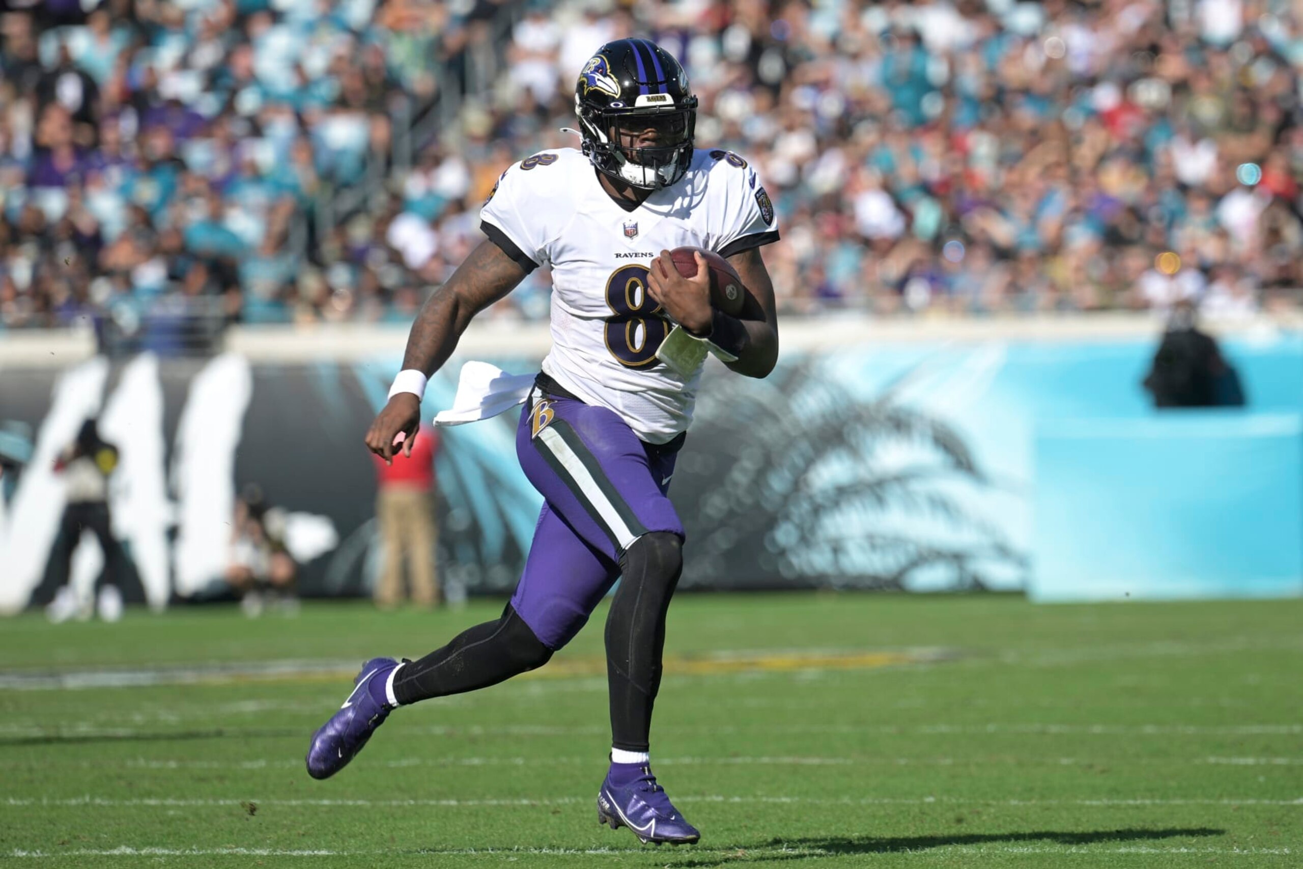 Baltimore Ravens quarterback Lamar Jackson (8) scrambles for yardage during the first half of an NFL football game against the Jacksonville Jaguars, Sunday, Nov. 27, 2022, in Jacksonville, Fla. (AP Photo/Phelan M. Ebenhack)