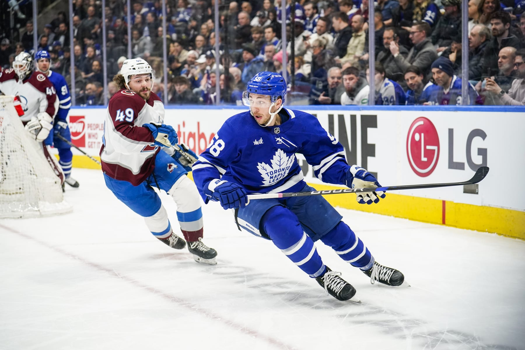 TORONTO, ON - MARCH 15: Michael Bunting #58 of the Toronto Maple Leafs skates against Samuel Girard #49 of the Colorado Avalanche during the first period at the Scotiabank Arena on March 15, 2023 in Toronto, Ontario, Canada. (Photo by Andrew Lahodynskyj/NHLI via Getty Images)