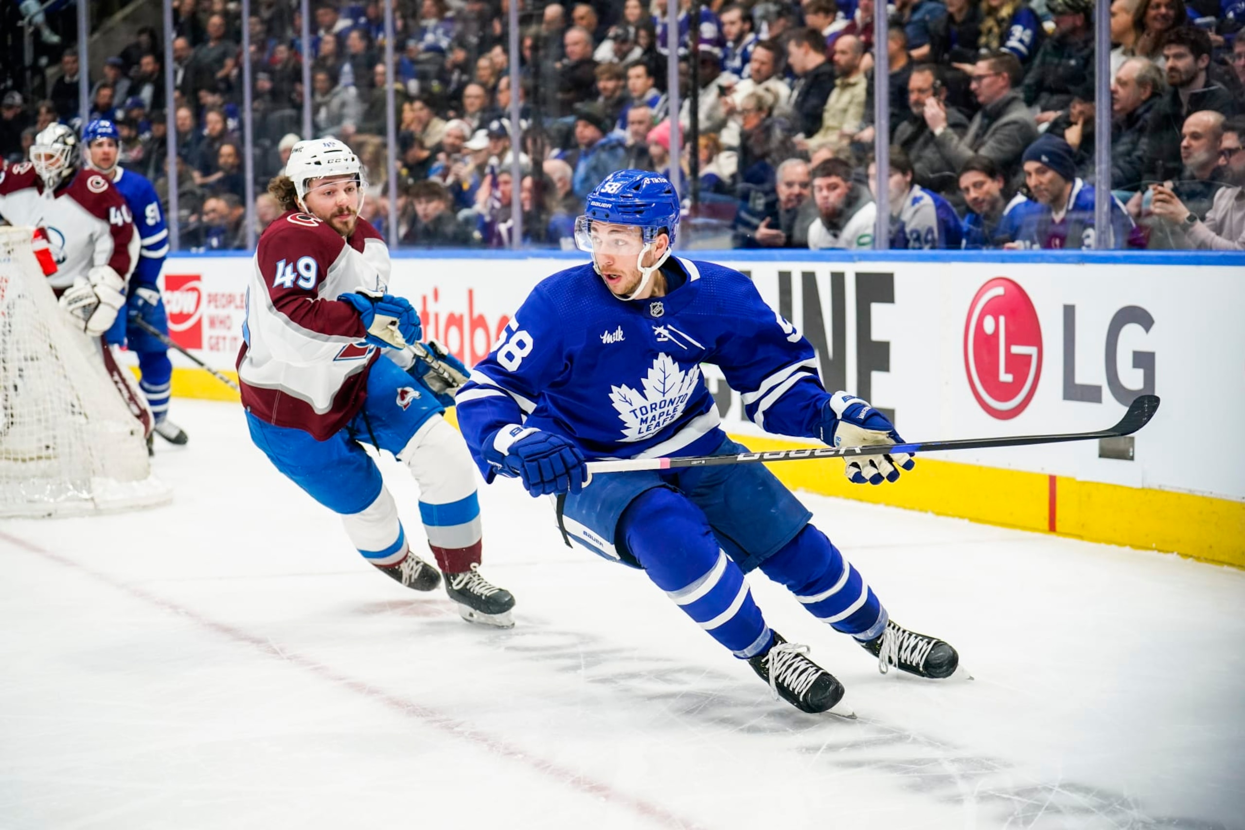 TORONTO, ON - MARCH 15: Michael Bunting #58 of the Toronto Maple Leafs skates against Samuel Girard #49 of the Colorado Avalanche during the first period at the Scotiabank Arena on March 15, 2023 in Toronto, Ontario, Canada. (Photo by Andrew Lahodynskyj/NHLI via Getty Images)
