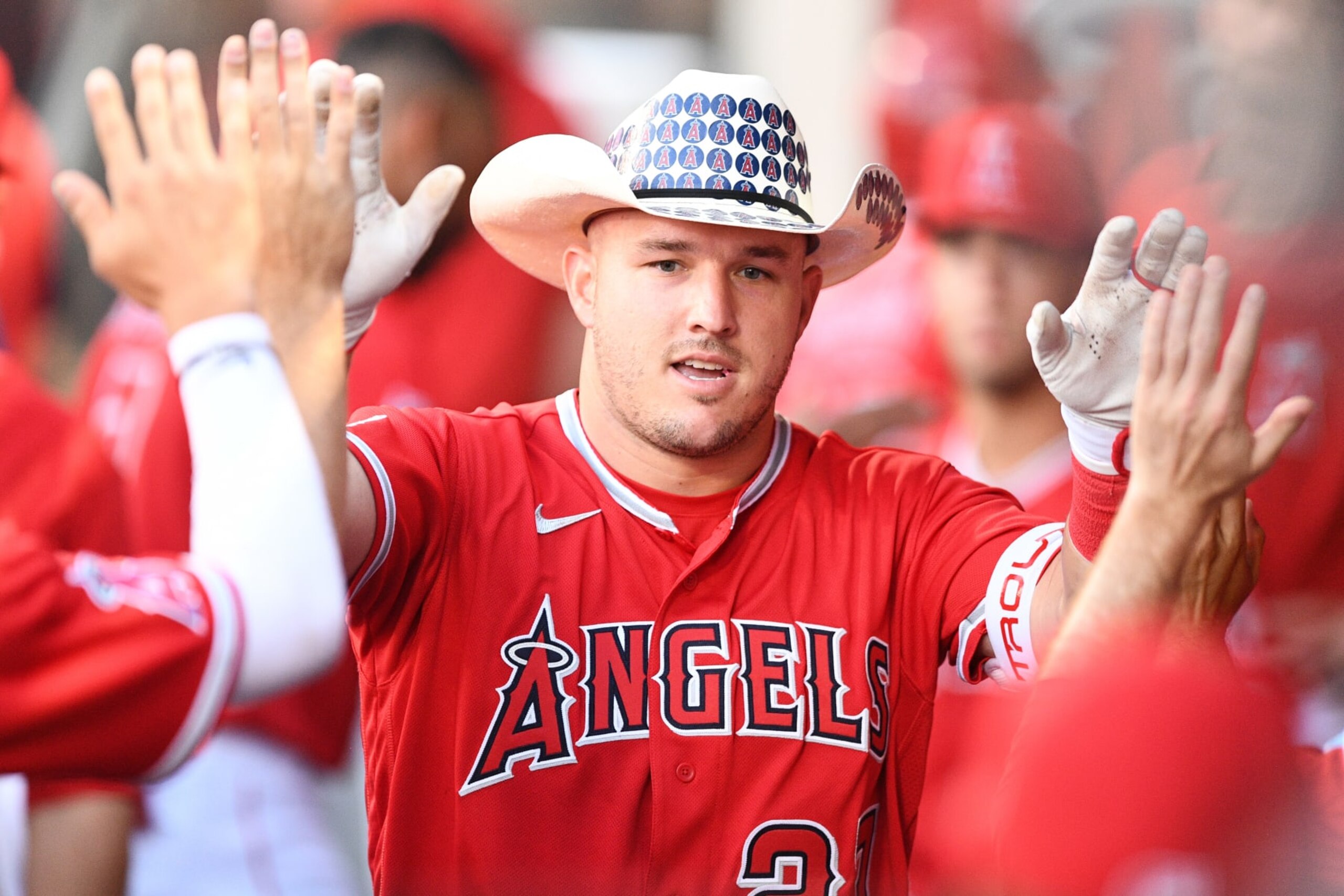 ANAHEIM, CA - SEPTEMBER 06: Los Angeles Angels center fielder Mike Trout (27) gets high fives after his first inning home run during the MLB game between the Detroit Tigers and the Los Angeles Angels of Anaheim on September 6, 2022 at Angel Stadium of Anaheim in Anaheim, CA. (Photo by Brian Rothmuller/Icon Sportswire via Getty Images)