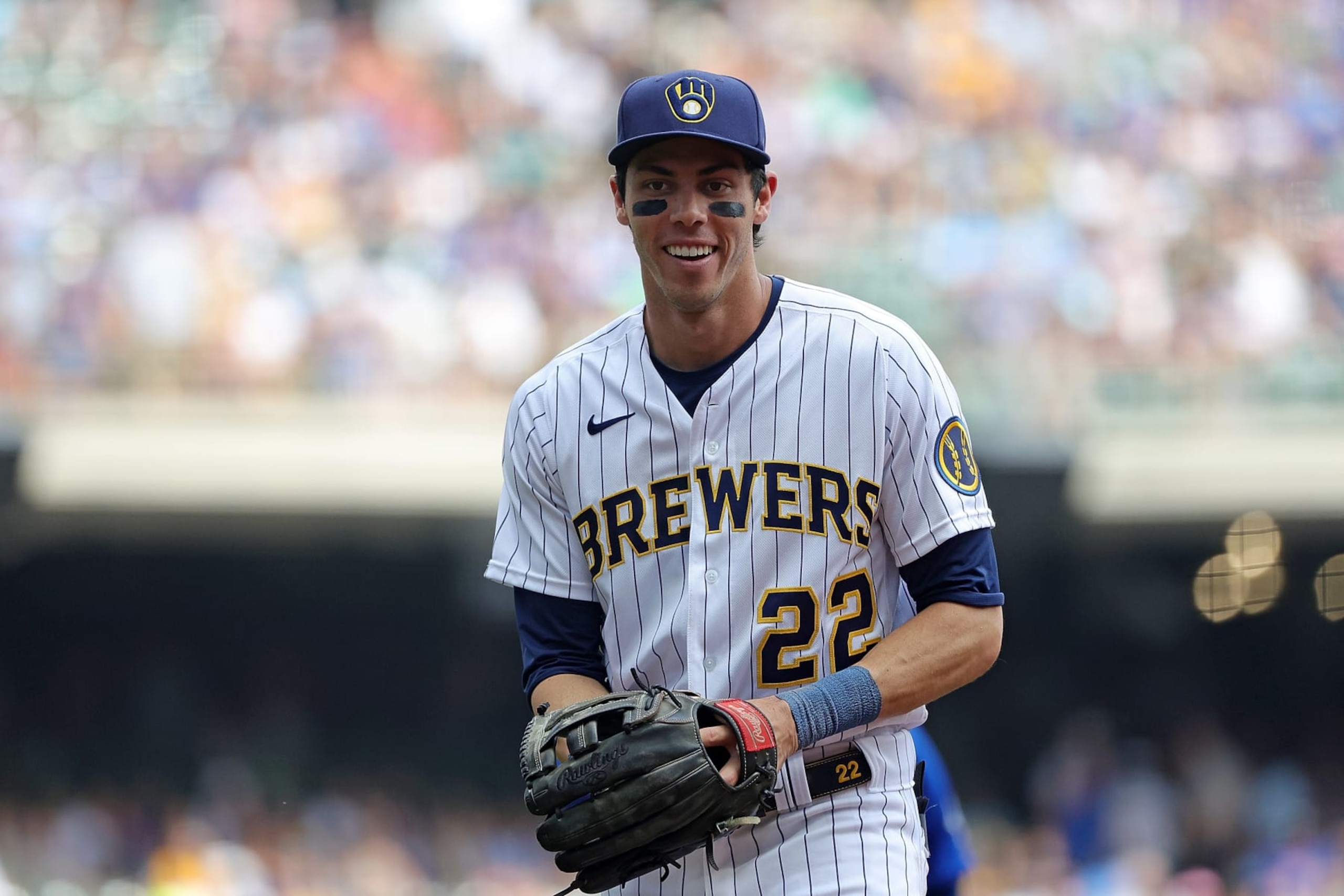 MILWAUKEE, WISCONSIN - AUGUST 28: Christian Yelich #22 of the Milwaukee Brewers walks to the dugout during a game against the Chicago Cubs at American Family Field on August 28, 2022 in Milwaukee, Wisconsin. (Photo by Stacy Revere/Getty Images)