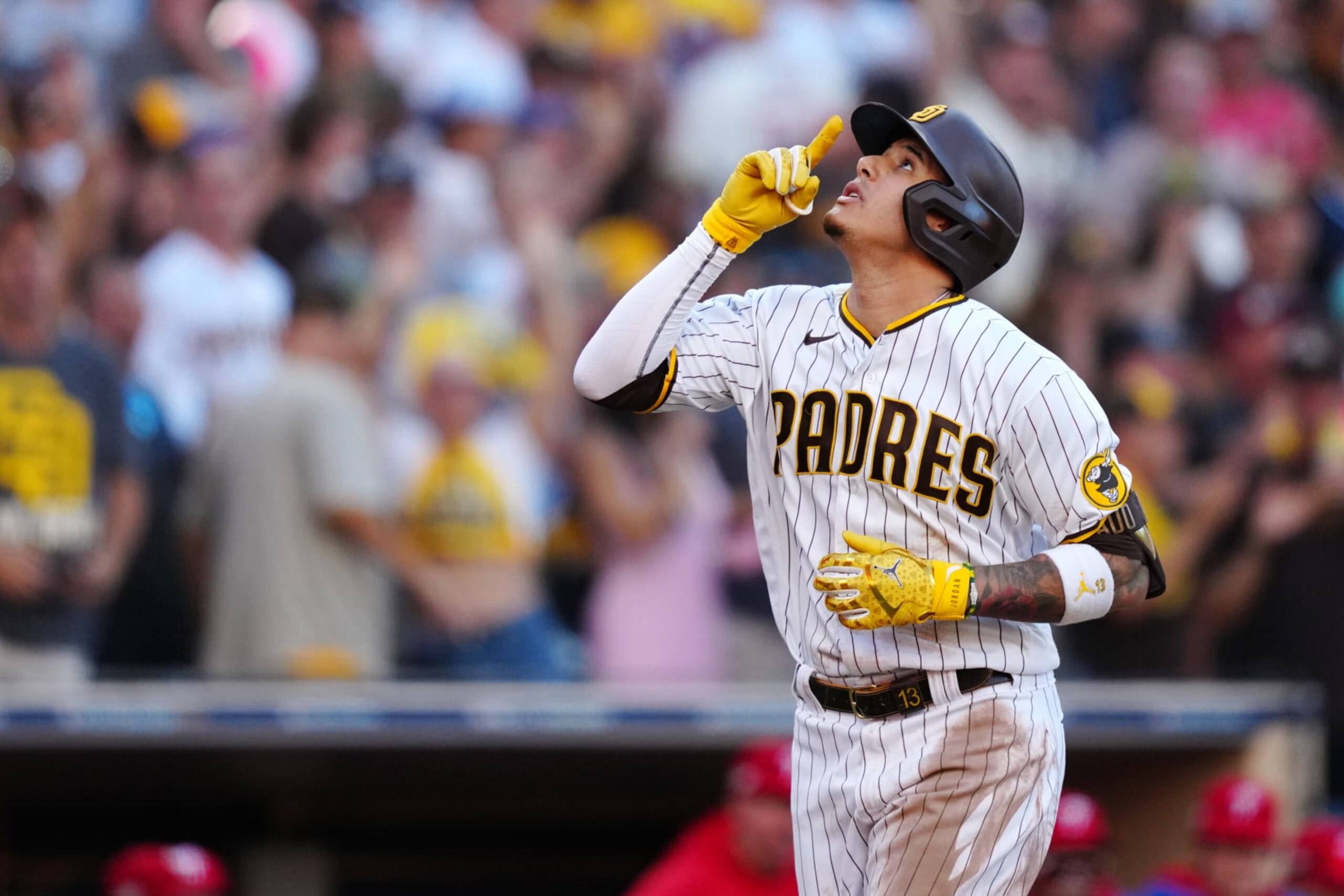 SAN DIEGO, CA - OCTOBER 19: Manny Machado #13 of the San Diego Padres reacts after a home run during Game 2 of the NLCS between the Philadelphia Phillies and the San Diego Padres at Petco Park on Wednesday, October 19, 2022 in San Diego, California. (Photo by Daniel Shirey/MLB Photos via Getty Images)