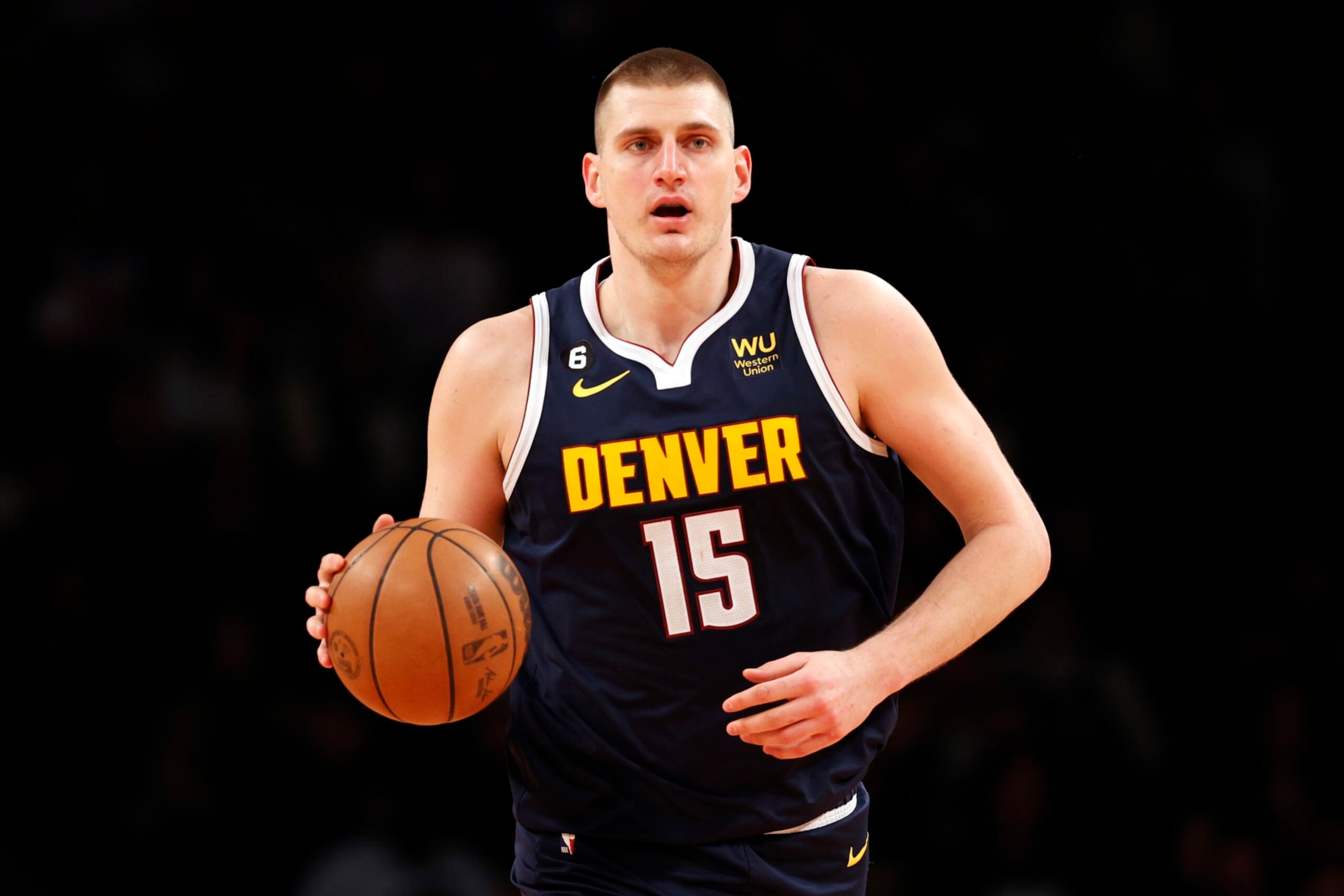 NEW YORK, NEW YORK - MARCH 19: Nikola Jokic #15 of the Denver Nuggets dribbles during the second half against the Brooklyn Nets at Barclays Center on March 19, 2023 in the Brooklyn borough of New York City. The Nuggets won 108-102. NOTE TO USER: User expressly acknowledges and agrees that, by downloading and/or using this photograph, User is consenting to the terms and conditions of the Getty Images License Agreement. (Photo by Sarah Stier/Getty Images)
