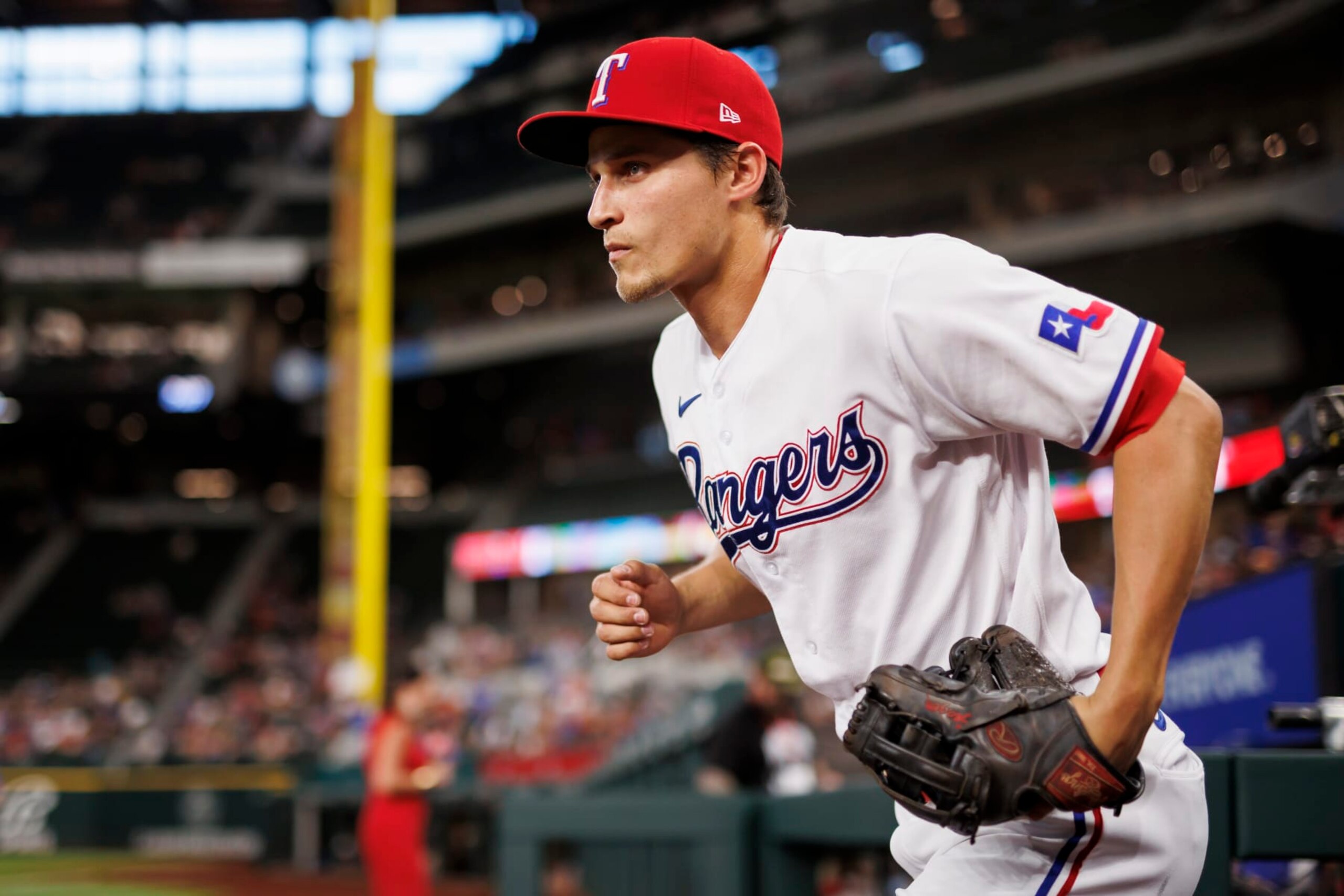 ARLINGTON, TX - JULY 14: Corey Seager #5 of the Texas Rangers runs out of the dugout during a game against the Seattle Mariners at Globe Life Field on July 14, 2022 in Arlington, Texas. (Photo by Ben Ludeman/Texas Rangers/Getty Images)