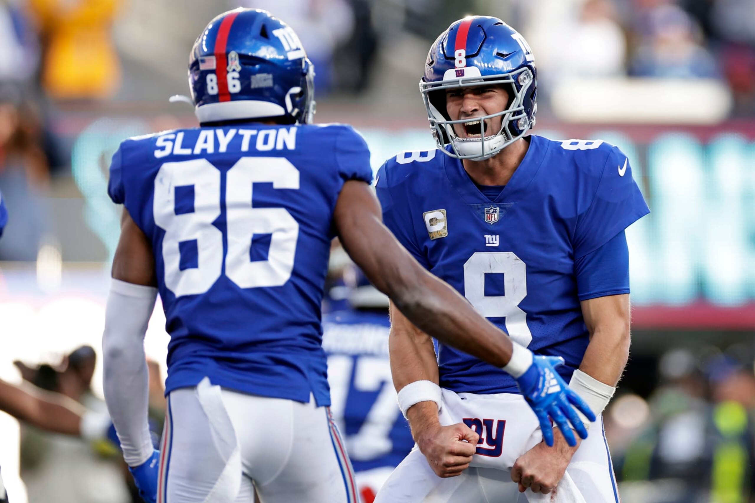New York Giants quarterback Daniel Jones (8) reacts after throwing a touchdown pass to Darius Slayton against the Houston Texans during an NFL football game Sunday, Nov. 13, 2022, in East Rutherford, N.J. (AP Photo/Adam Hunger)
