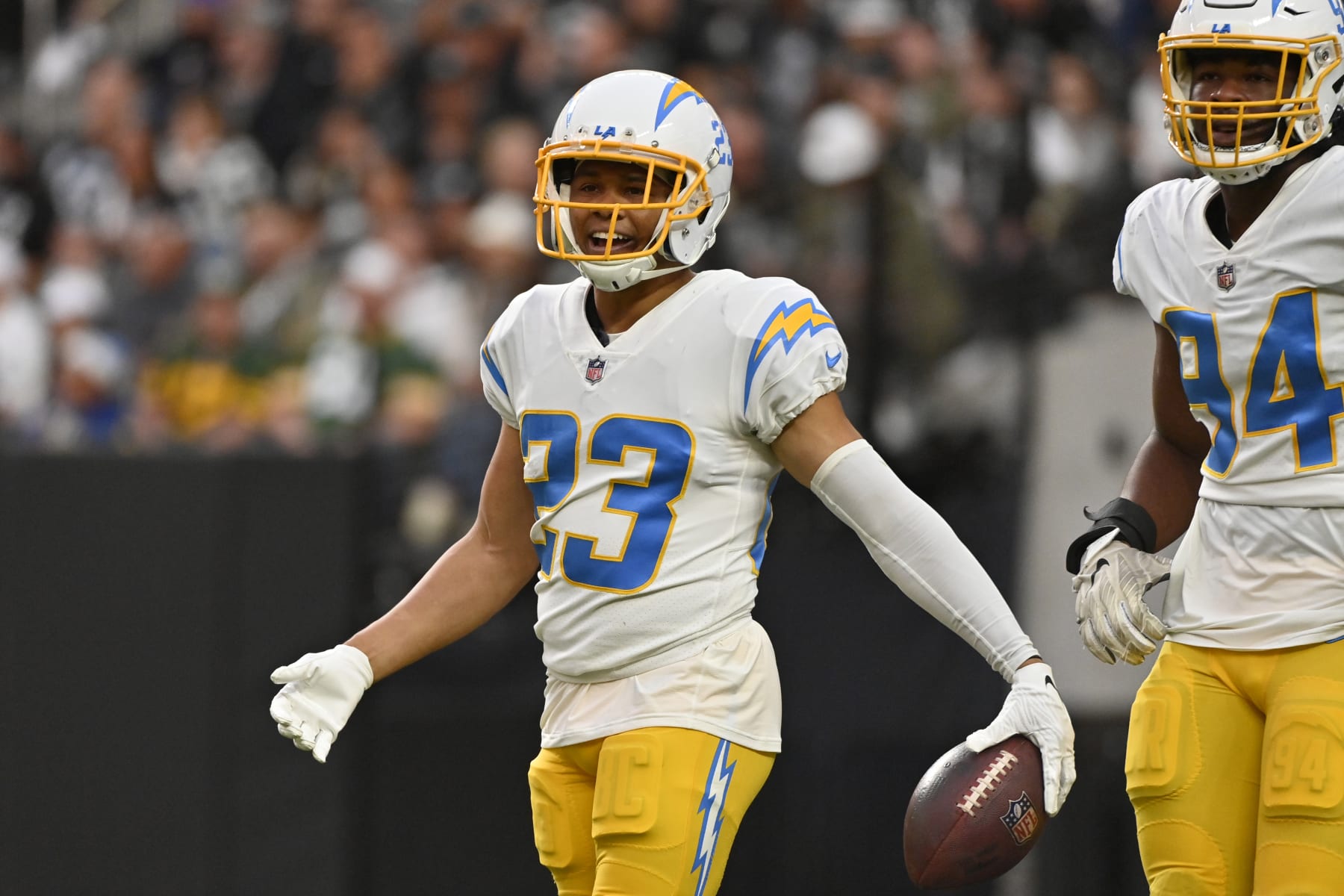 Los Angeles Chargers cornerback Bryce Callahan (23) reacts after returning an interception for a touchdown during the first half of an NFL football game against the Las Vegas Raiders, Sunday, Dec. 4, 2022, in Las Vegas. (AP Photo/David Becker)