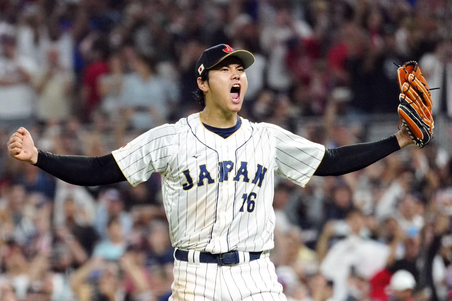 MIAMI, FL - MARCH 21:  Shohei Ohtani #16 of Team Japan celebrates on the field after Team Japan defeated Team USA in the 2023 World Baseball Classic Championship game at loanDepot Park on Tuesday, March 21, 2023 in Miami, Florida. (Photo by Mary DeCicco/WBCI/MLB Photos via Getty Images)