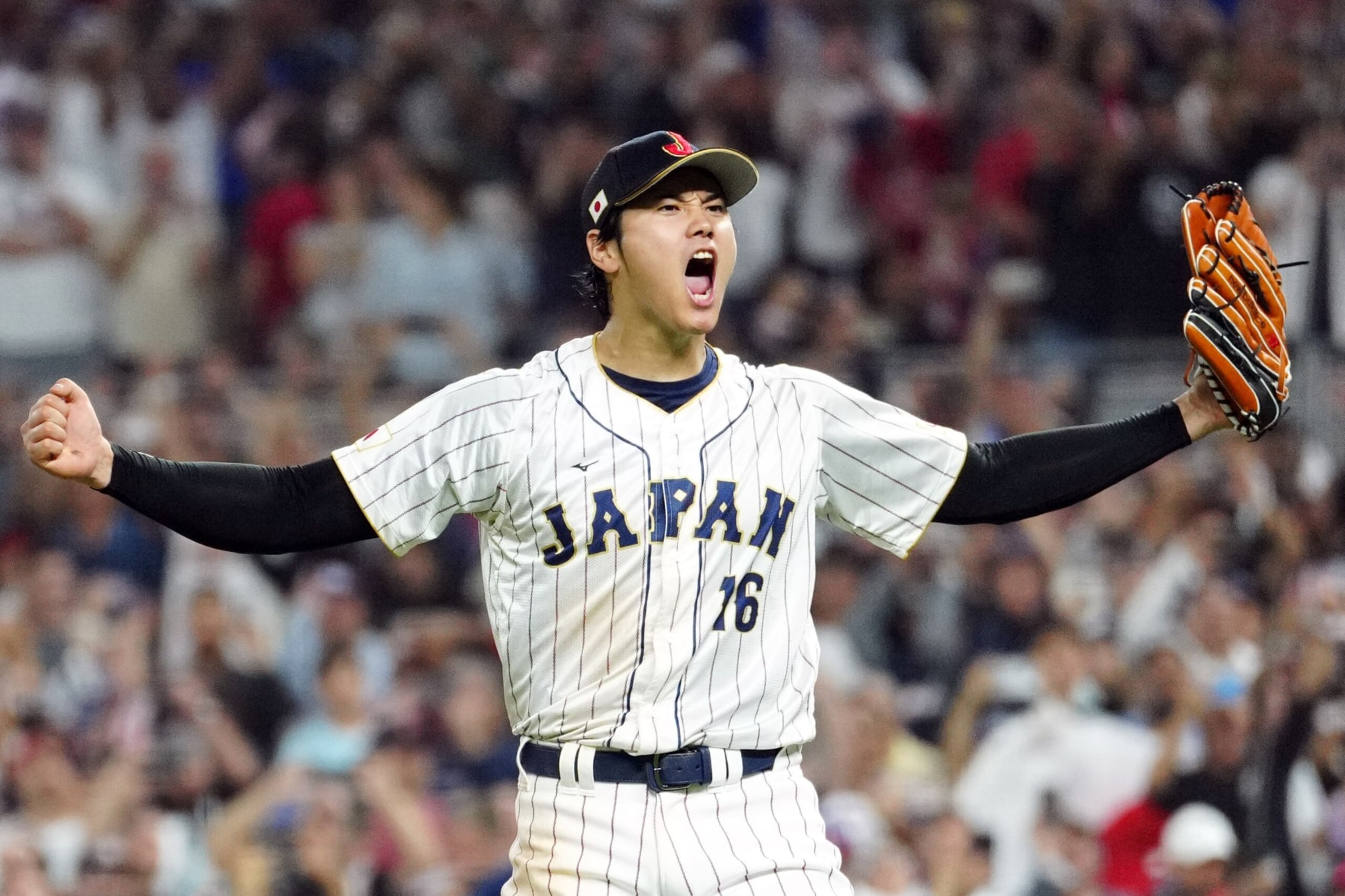 MIAMI, FL - MARCH 21:  Shohei Ohtani #16 of Team Japan celebrates on the field after Team Japan defeated Team USA in the 2023 World Baseball Classic Championship game at loanDepot Park on Tuesday, March 21, 2023 in Miami, Florida. (Photo by Mary DeCicco/WBCI/MLB Photos via Getty Images)