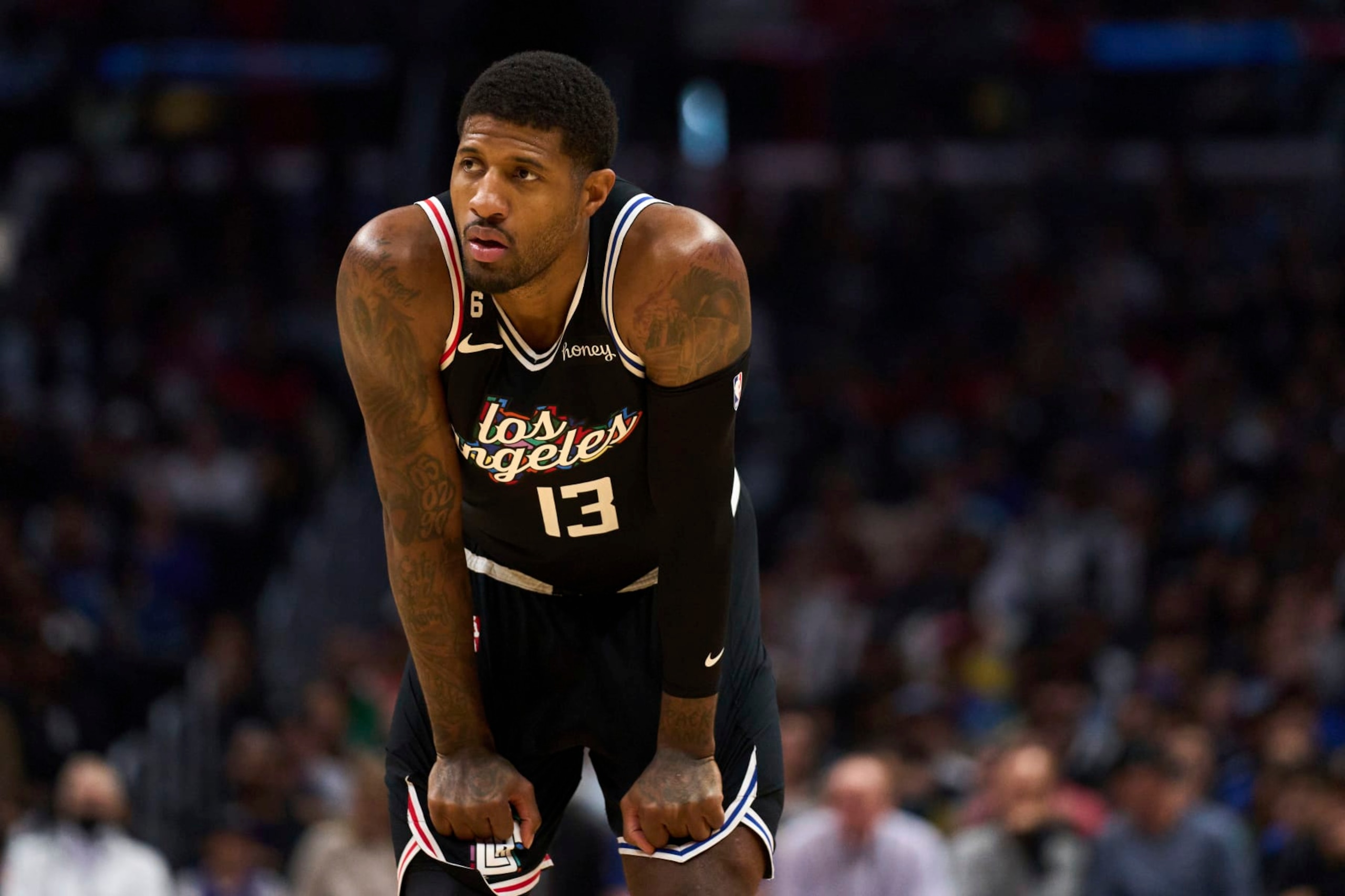 Los Angeles Clippers forward Paul George (13) looks down the court during the second half of an NBA basketball game against Orlando Magic Saturday, March 18, 2023, in Los Angeles. (AP Photo/Allison Dinner)