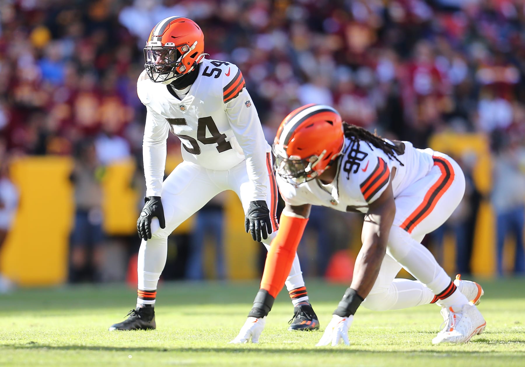 LANDOVER, MD - JANUARY 01: Cleveland Browns linebacker Deion Jones (54) and defensive end Jadeveon Clowney (90) peek into the backfield during the Cleveland Browns game versus the Washington Commanders on January 01, 2023, at FedEx Field in Landover, MD. (Photo by Lee Coleman/Icon Sportswire via Getty Images)